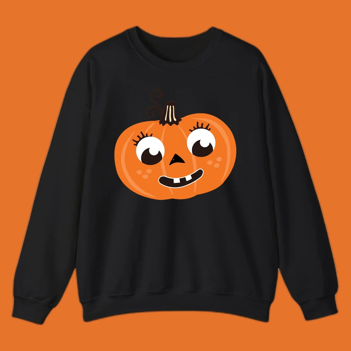 Cute halloween pumpkin face graphic with big eyes and a smile.