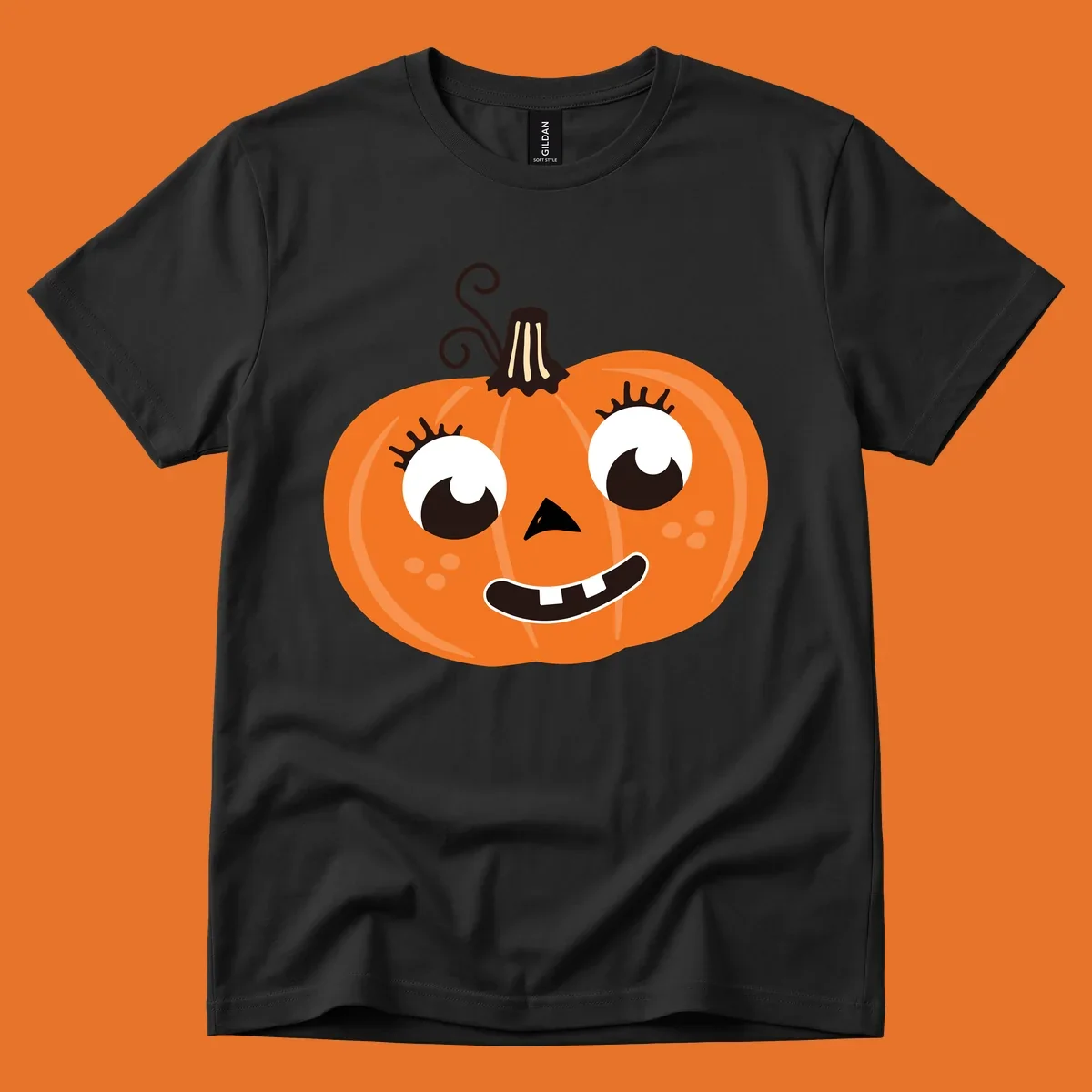 Cute halloween pumpkin face graphic with big eyes and a smile.