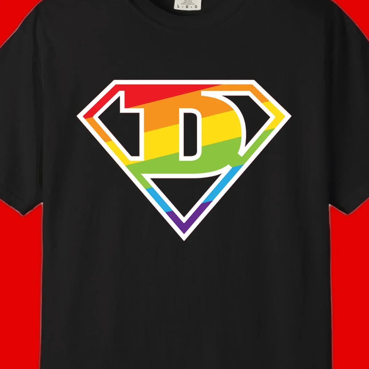 Rainbow pride shield with letter D centered, featuring red, orange, yellow, green, blue, and purple horizontal stripes with white chevron borders