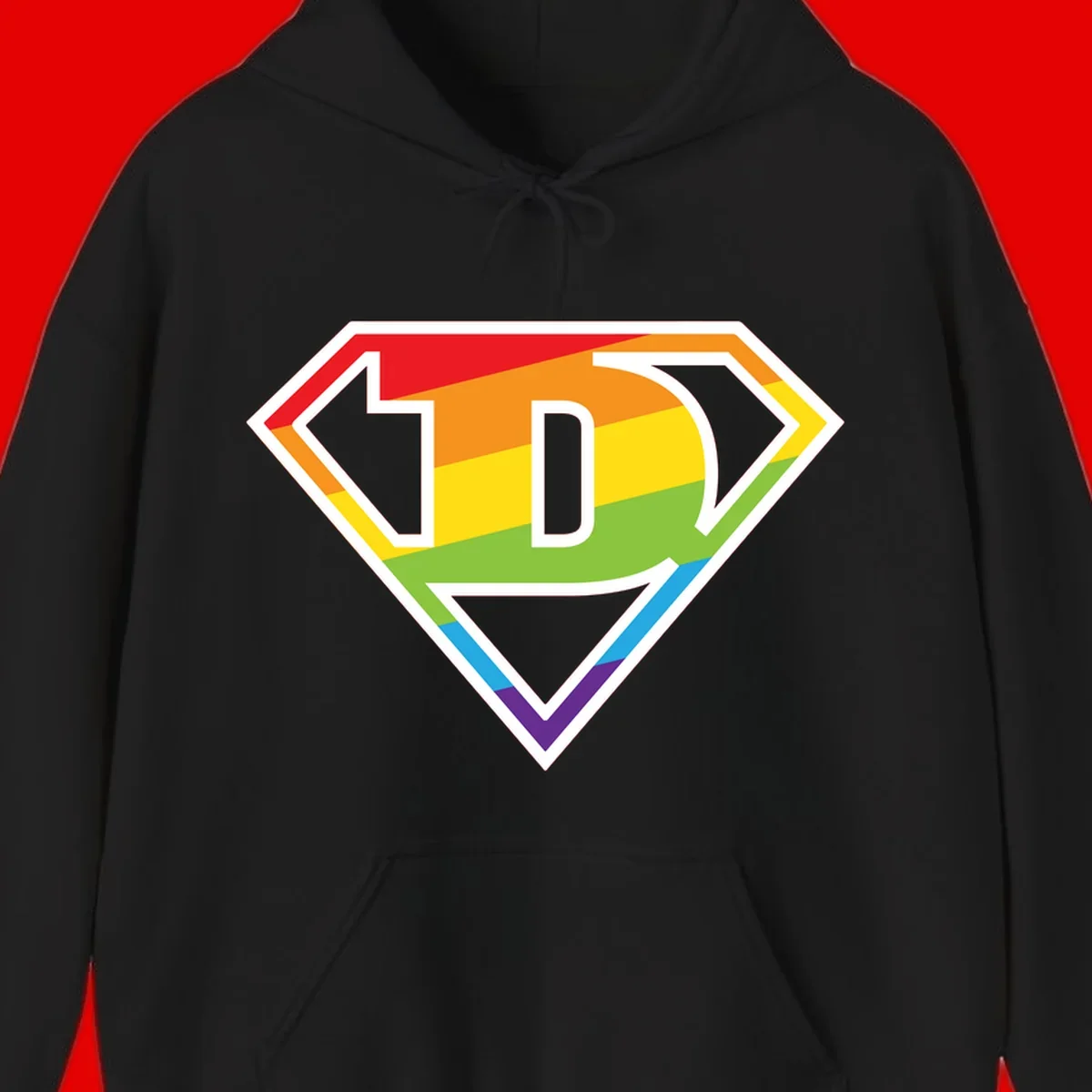 Rainbow pride shield with letter D centered, featuring red, orange, yellow, green, blue, and purple horizontal stripes with white chevron borders