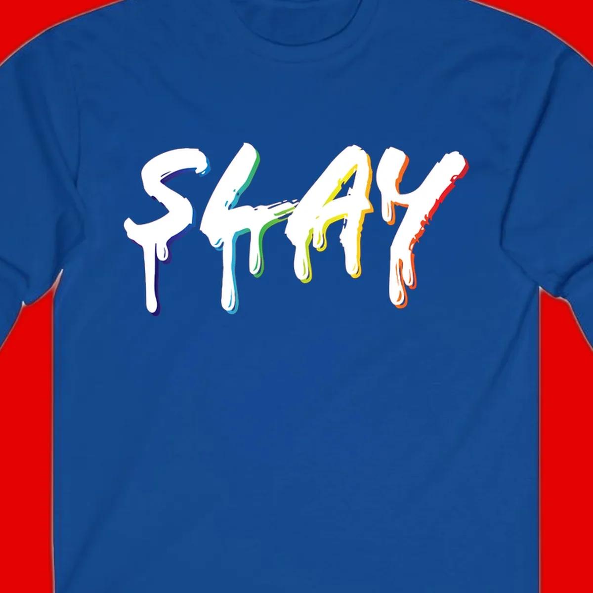 The word STAY in white letters with rainbow pride-colored paint drips flowing downward, featuring blue, teal, green, yellow, orange, and red colors on gray background