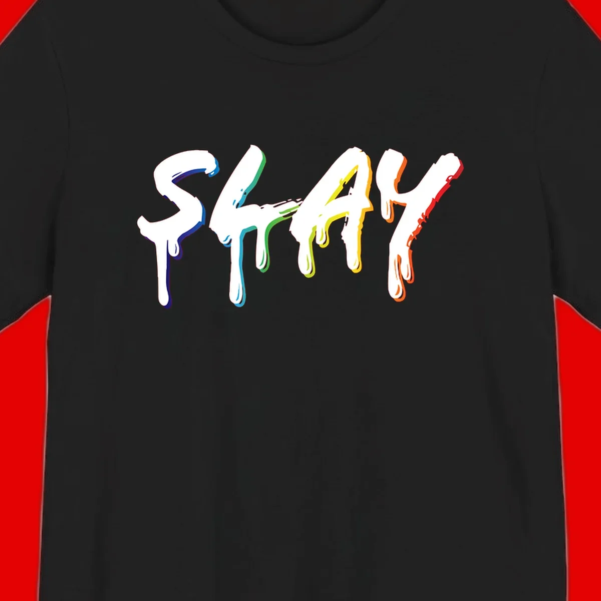 The word STAY in white letters with rainbow pride-colored paint drips flowing downward, featuring blue, teal, green, yellow, orange, and red colors on gray background