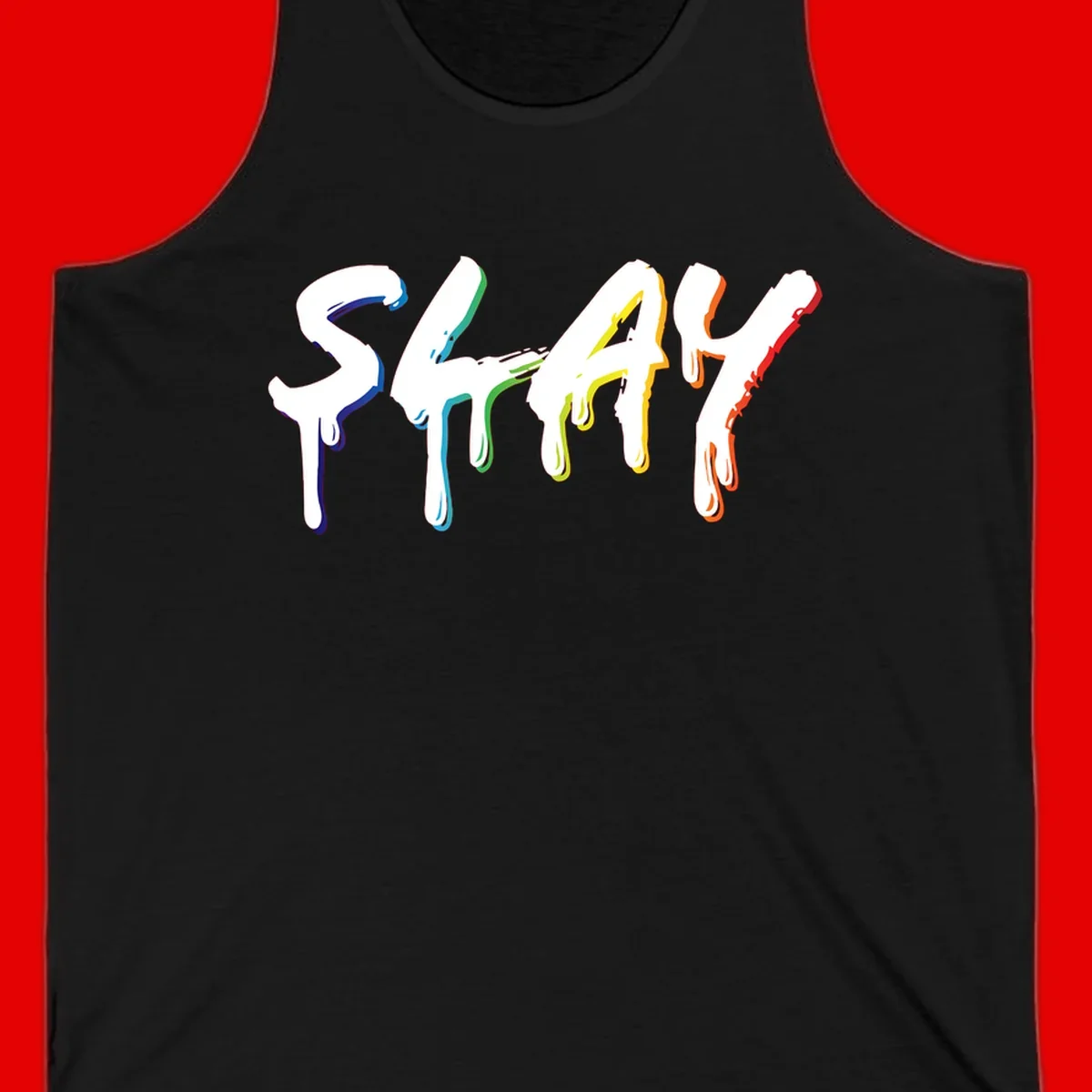 The word STAY in white letters with rainbow pride-colored paint drips flowing downward, featuring blue, teal, green, yellow, orange, and red colors on gray background