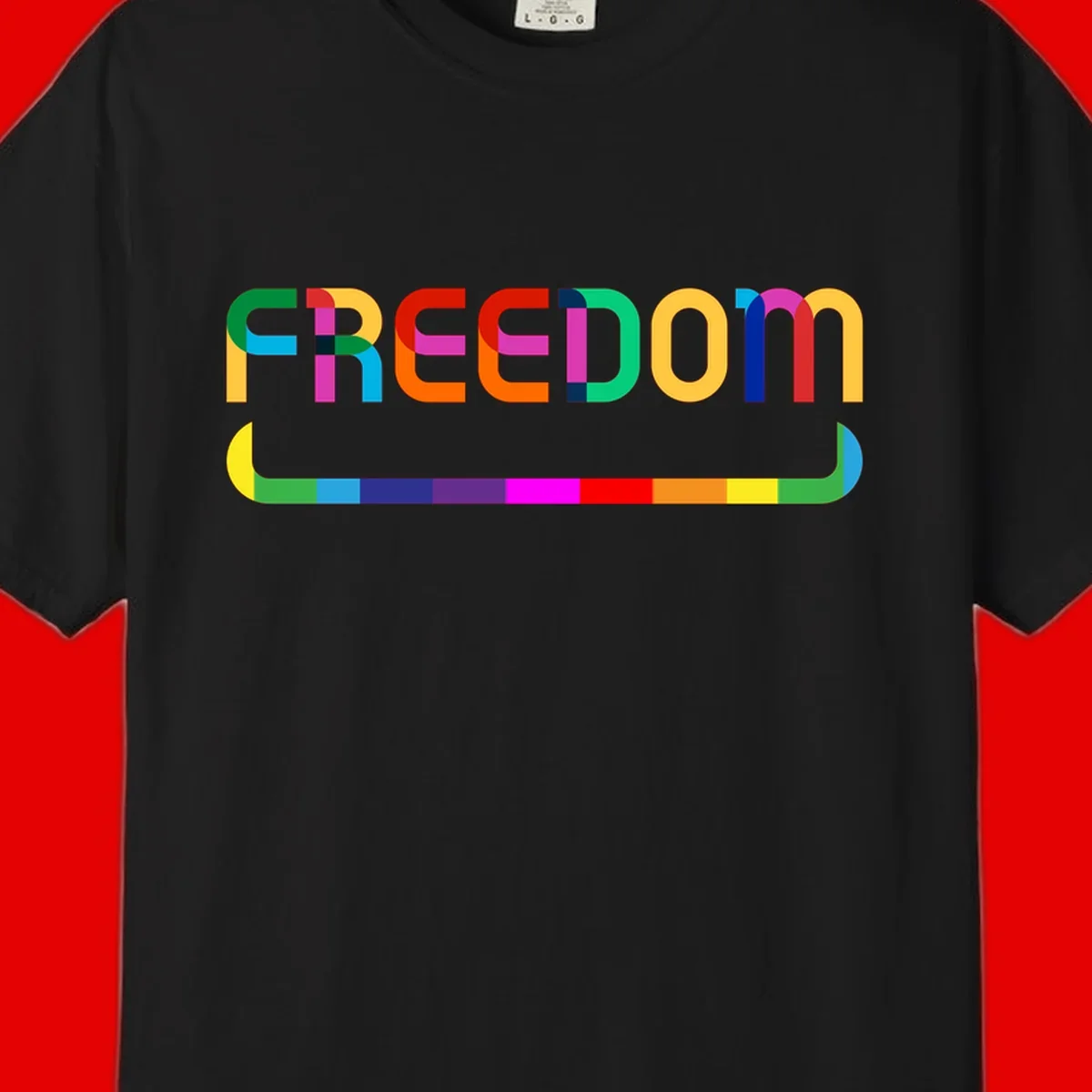 Colorful FREEDOM text in rainbow letters with geometric shapes and pride flag color bar below on gray background