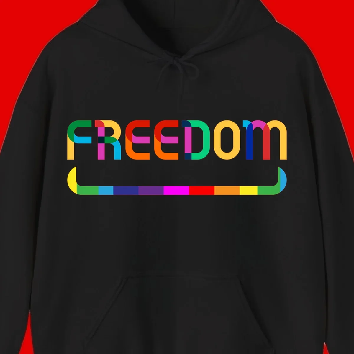 Colorful FREEDOM text in rainbow letters with geometric shapes and pride flag color bar below on gray background