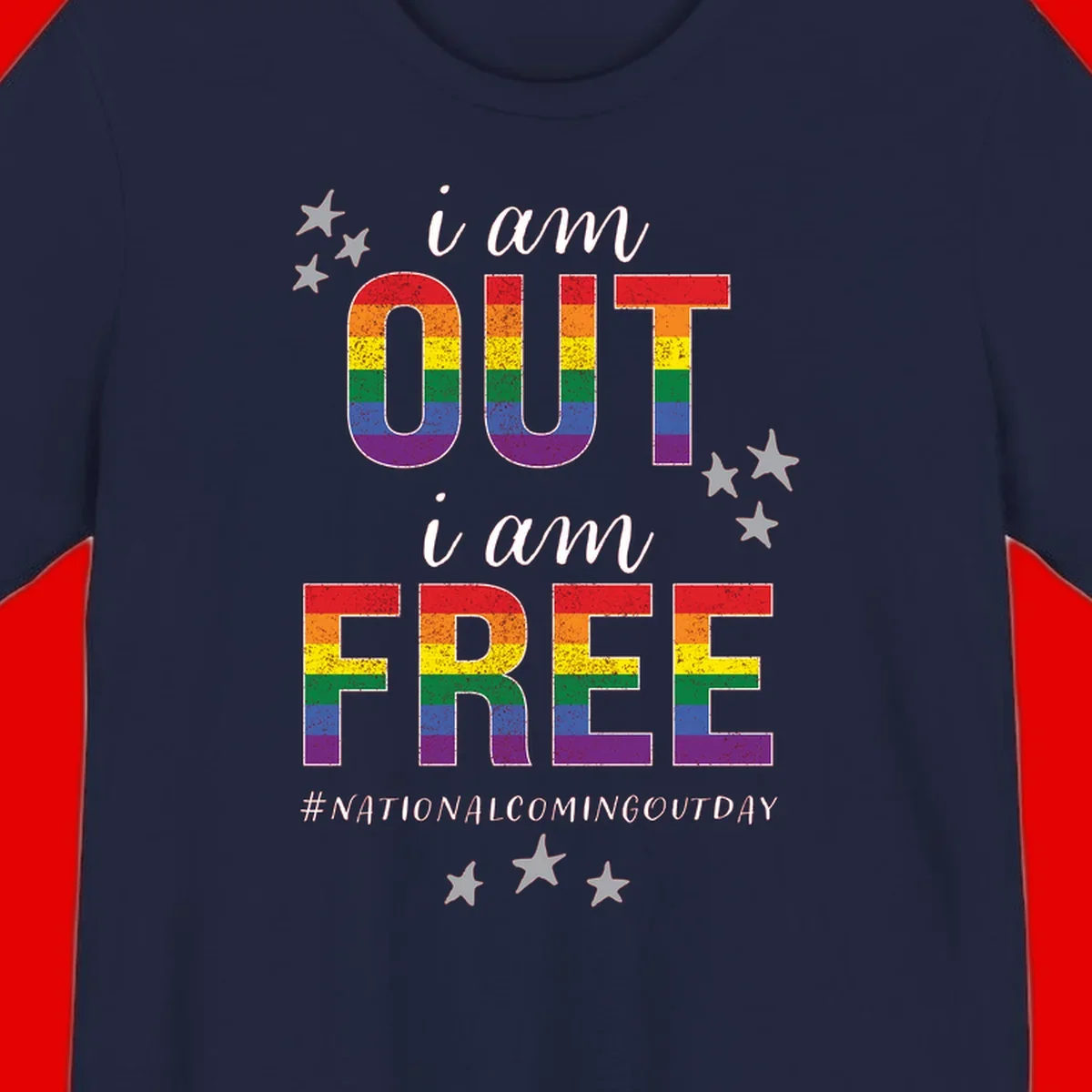 Rainbow-striped letters spelling 'i am OUT i am FREE' with decorative stars on gray background celebrating National Coming Out Day pride.