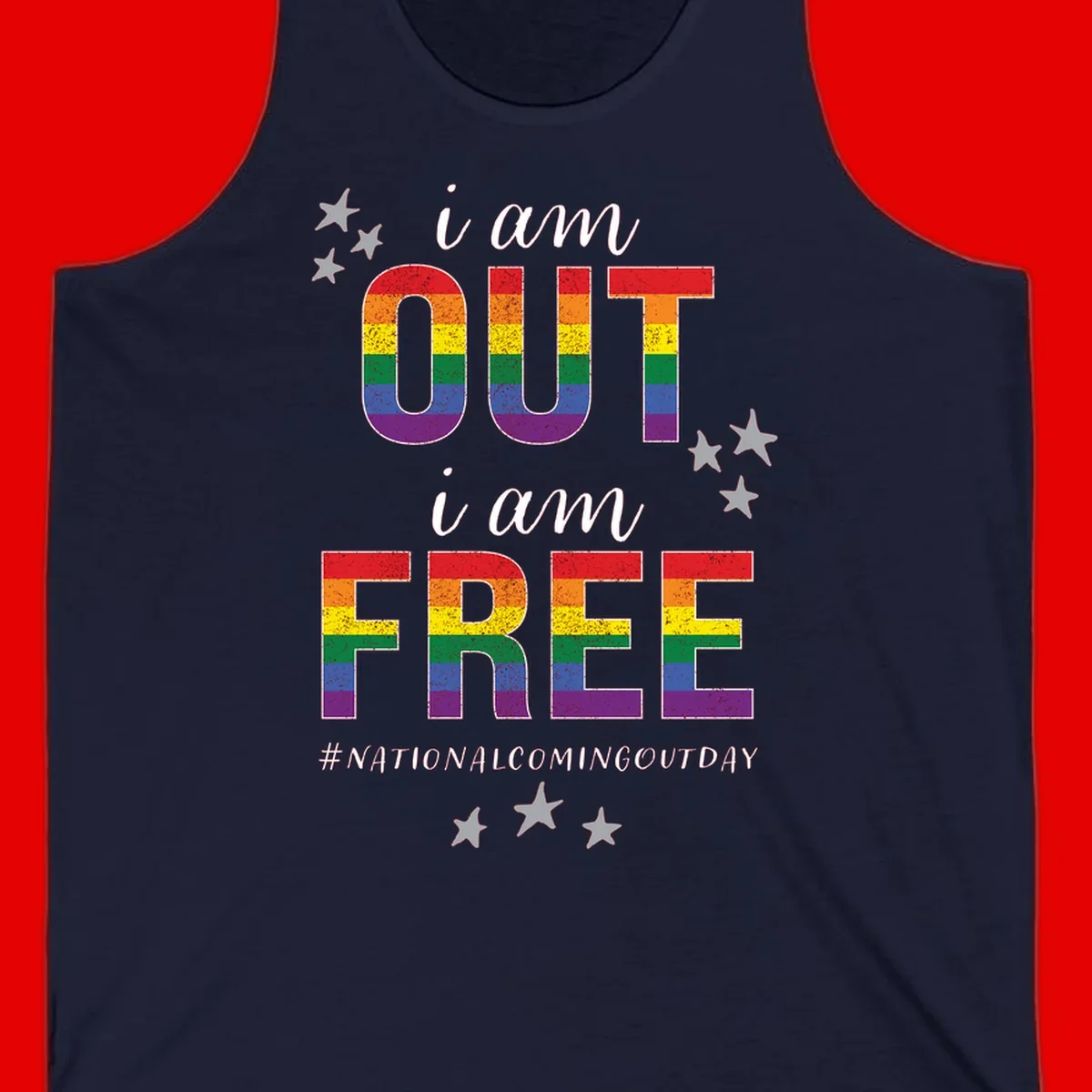 Rainbow-striped letters spelling 'i am OUT i am FREE' with decorative stars on gray background celebrating National Coming Out Day pride.