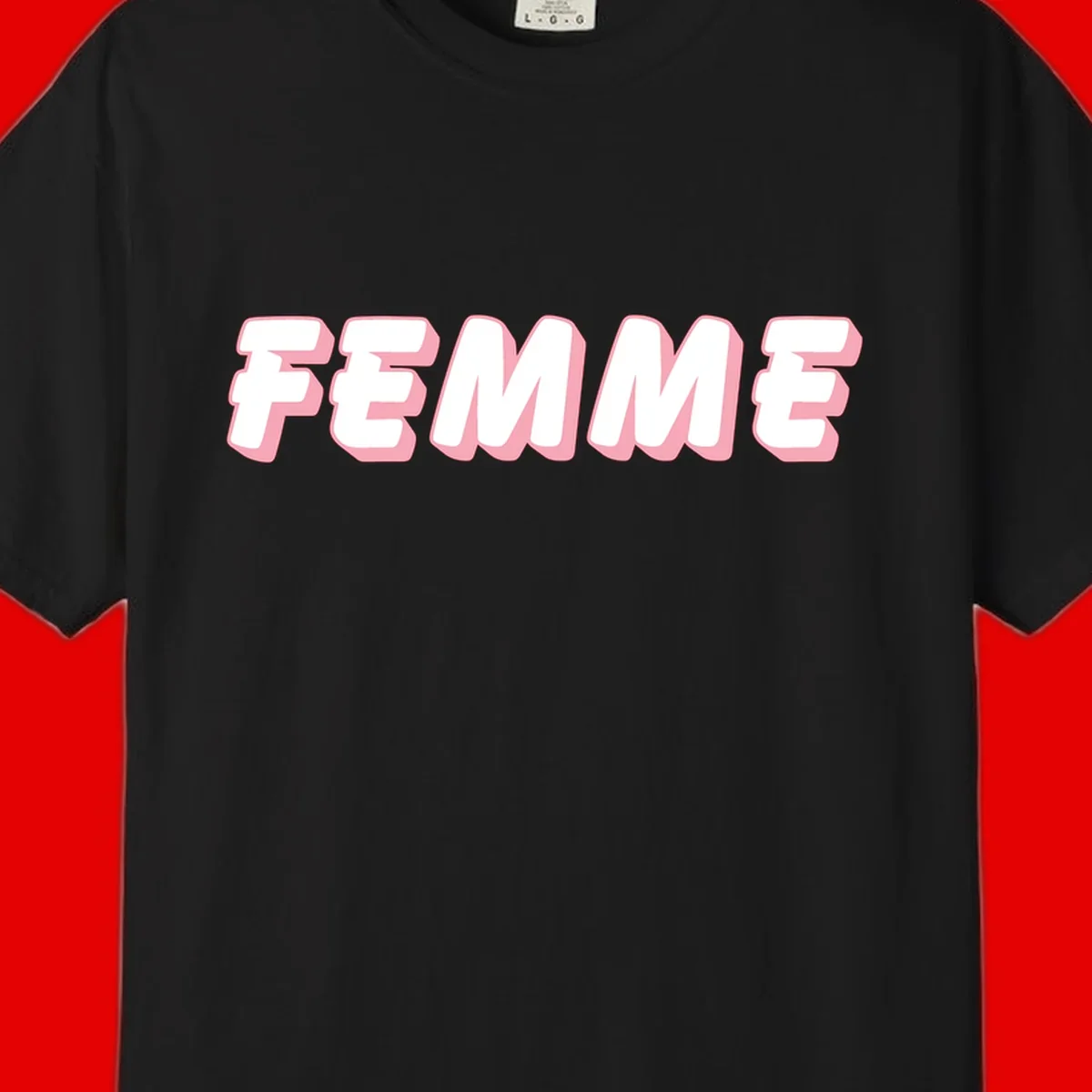 Bold 3D lettering spelling FEMME in white with pink dimensional shadowing on gray background