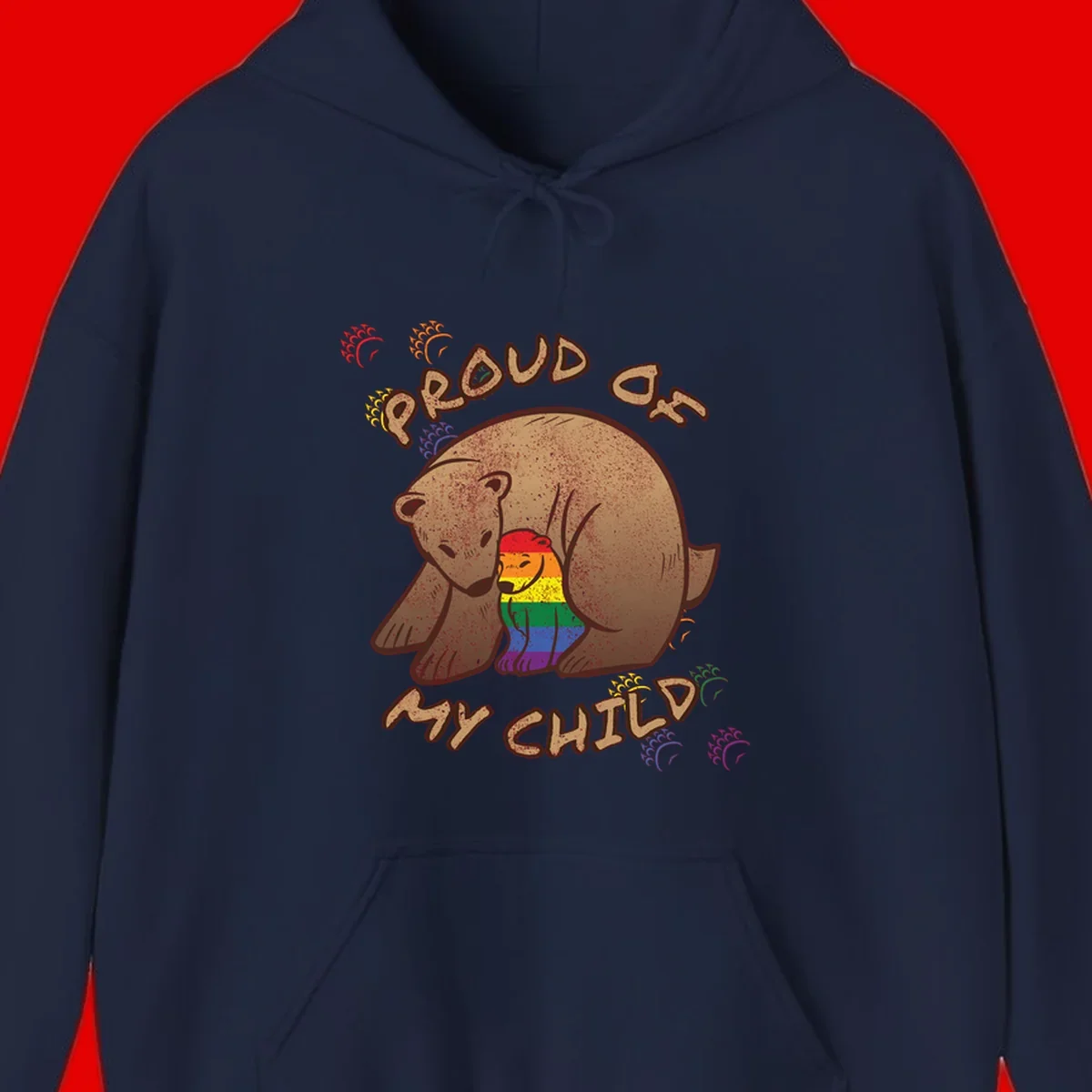 Brown bear proudly displaying rainbow pride colors with 'Proud As Shit' text and decorative bursts