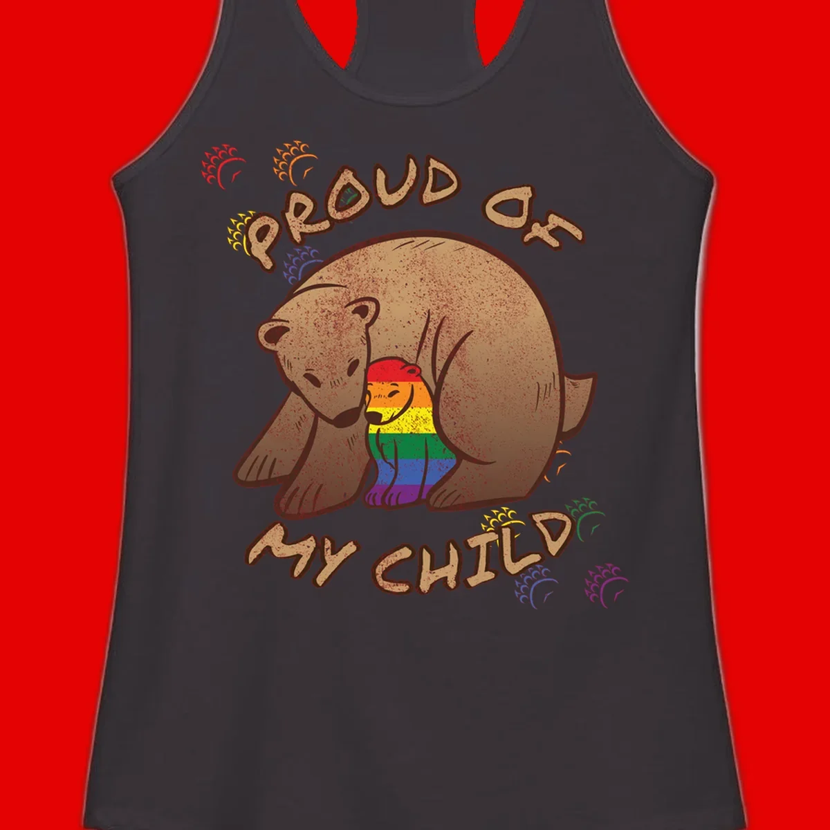 Brown bear proudly displaying rainbow pride colors with 'Proud As Shit' text and decorative bursts