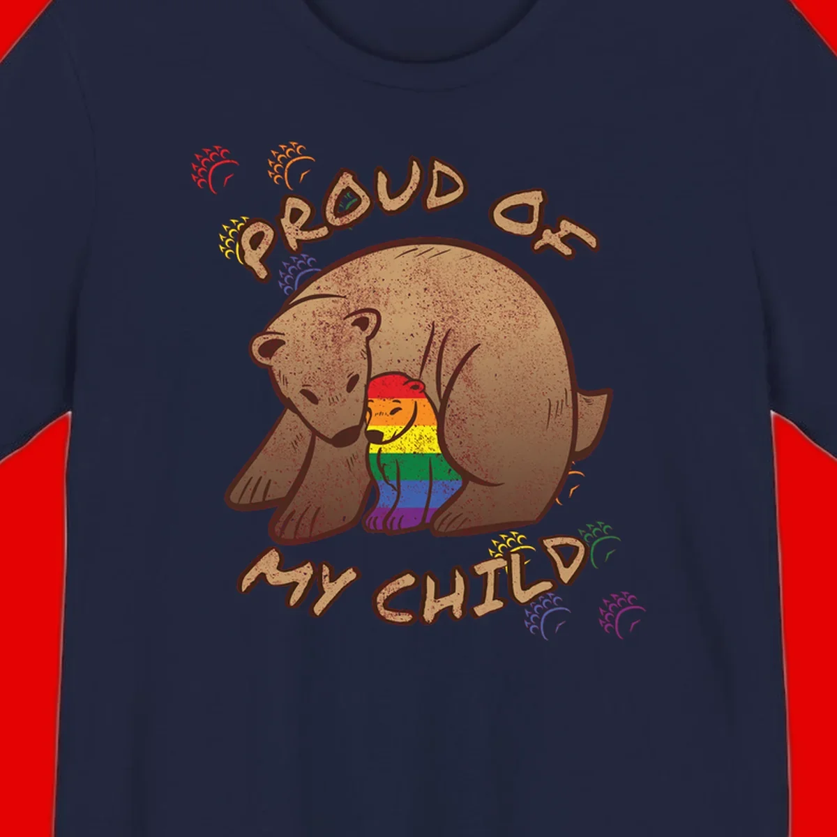 Brown bear proudly displaying rainbow pride colors with 'Proud As Shit' text and decorative bursts