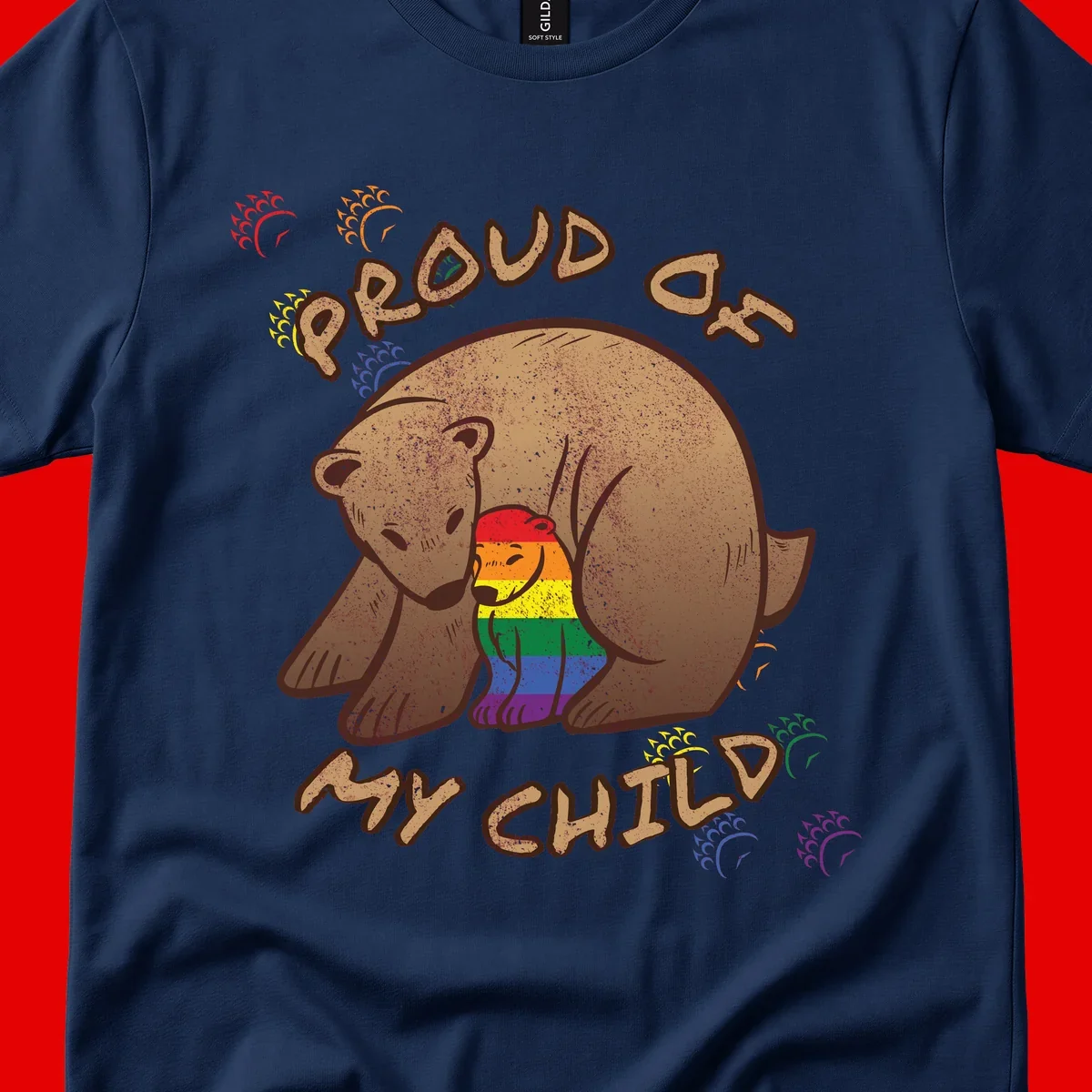 Brown bear proudly displaying rainbow pride colors with 'Proud As Shit' text and decorative bursts