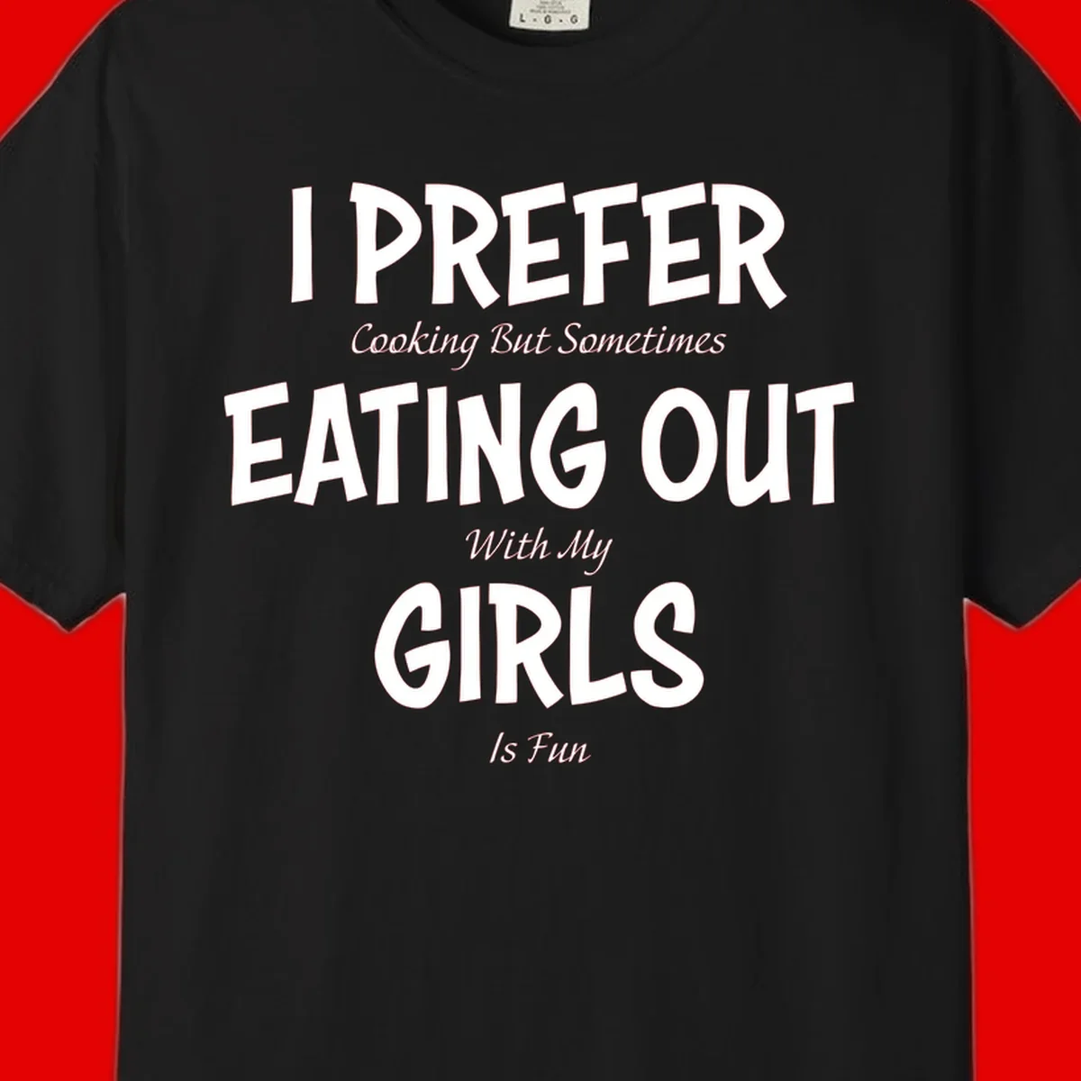 Humorous text design reading 'I Prefer Cooking But Sometimes Eating Out With My Girls Is Fun' in white bold letters on gray background