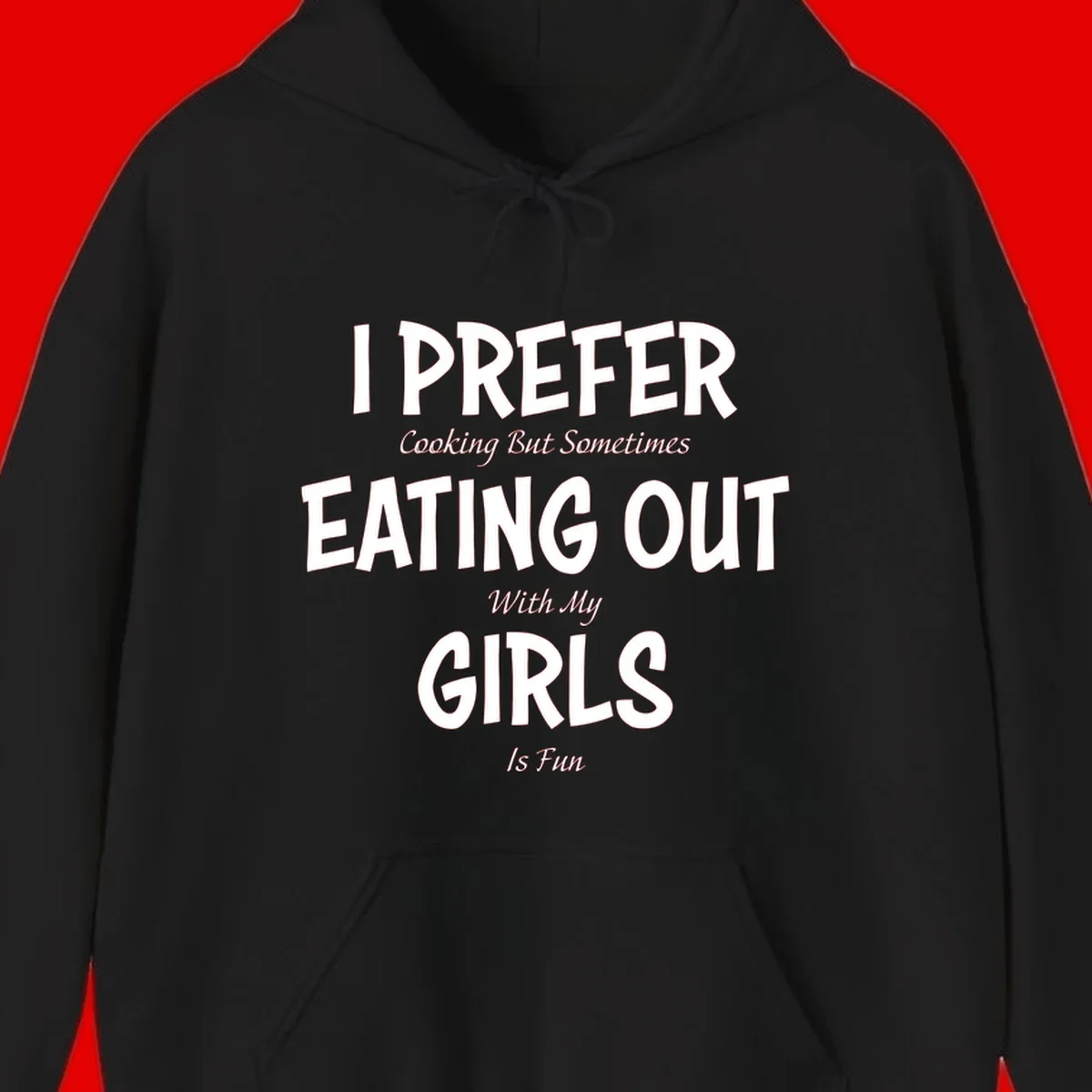 Humorous text design reading 'I Prefer Cooking But Sometimes Eating Out With My Girls Is Fun' in white bold letters on gray background