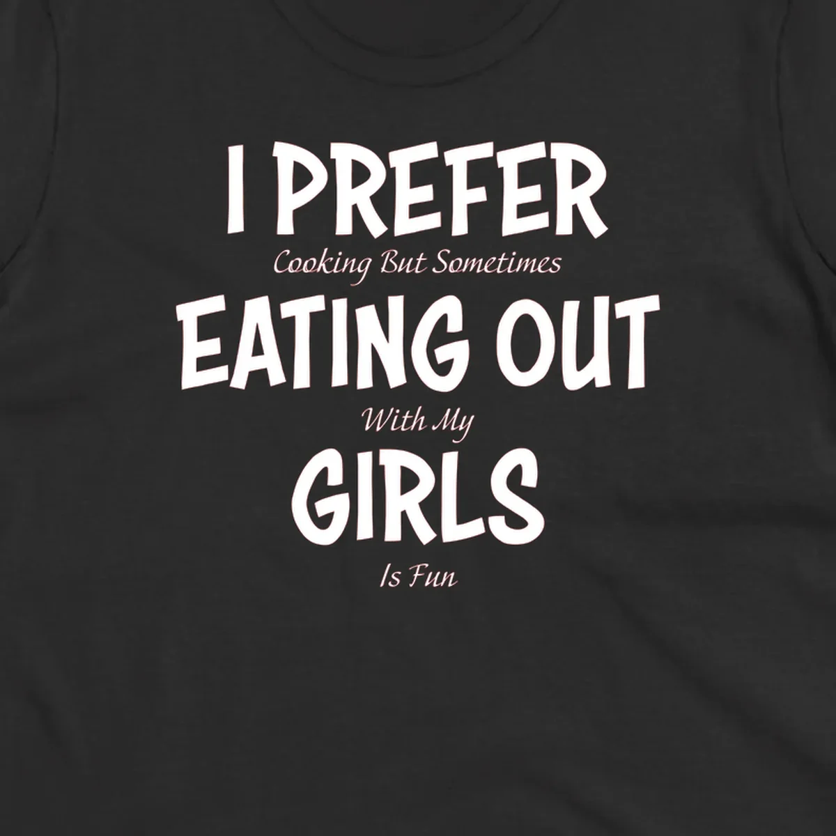 Humorous text design reading 'I Prefer Cooking But Sometimes Eating Out With My Girls Is Fun' in white bold letters on gray background