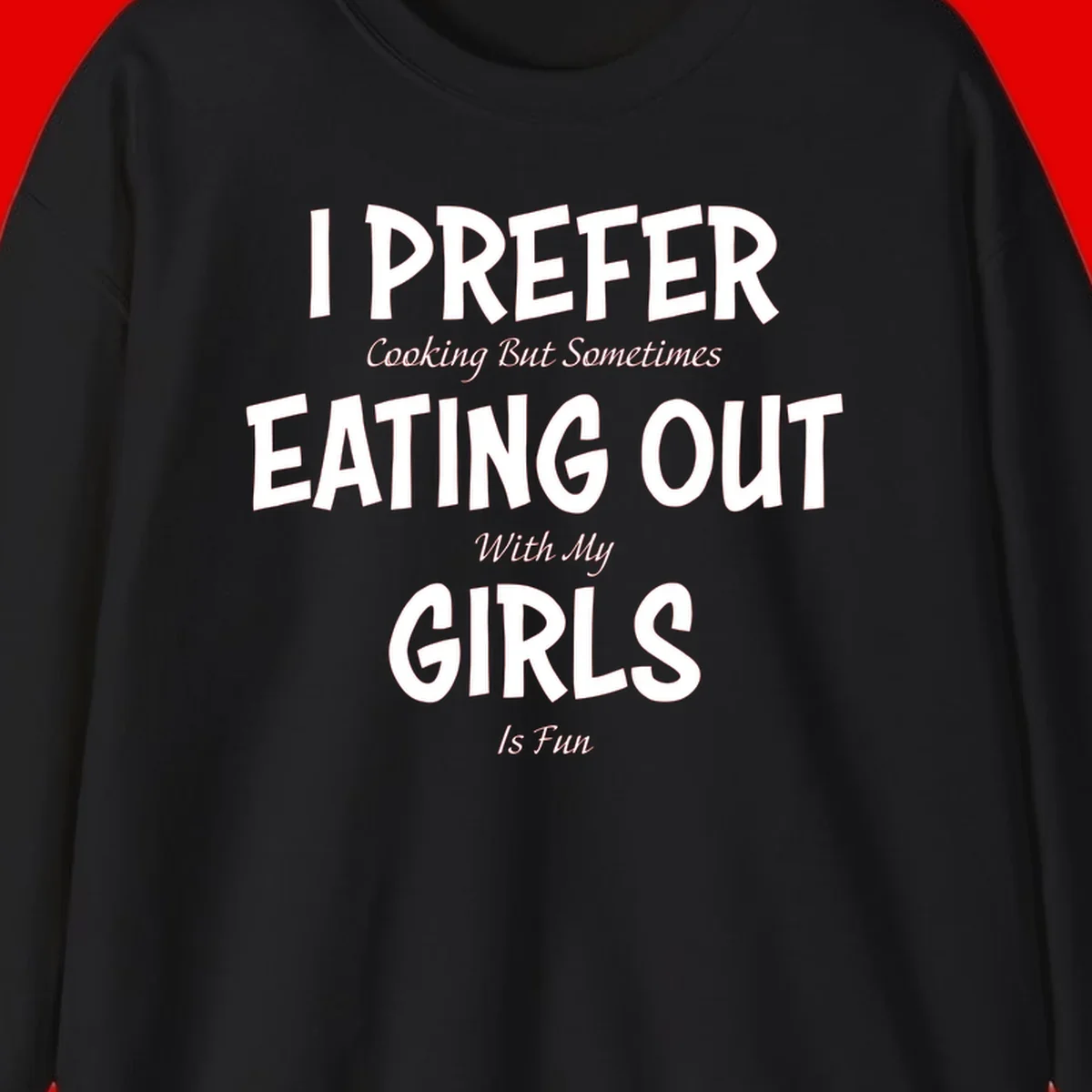 Humorous text design reading 'I Prefer Cooking But Sometimes Eating Out With My Girls Is Fun' in white bold letters on gray background