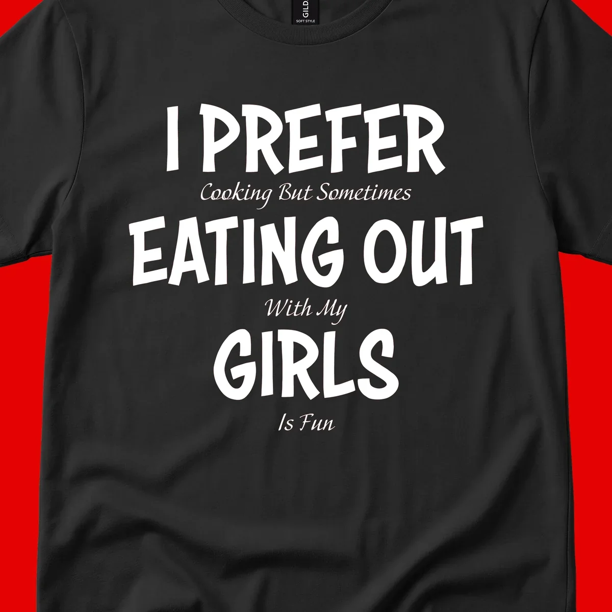 Humorous text design reading 'I Prefer Cooking But Sometimes Eating Out With My Girls Is Fun' in white bold letters on gray background