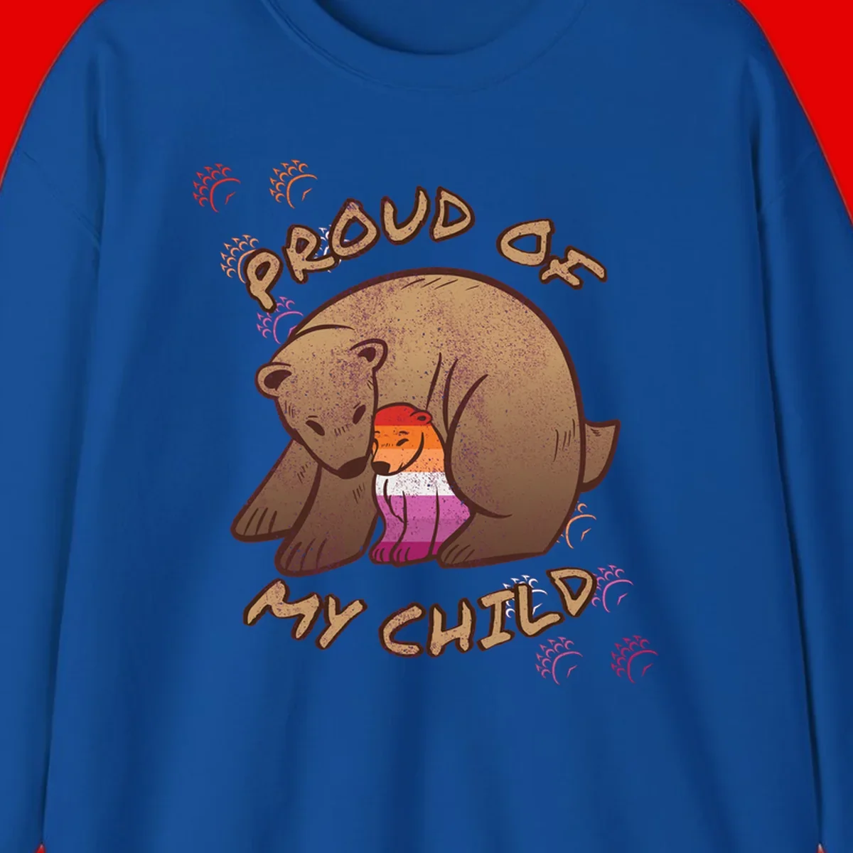 Brown bear proudly holding a sushi roll with pride flag stripes, surrounded by sparkles and text reading 'PROUD AS MY SUSHI'