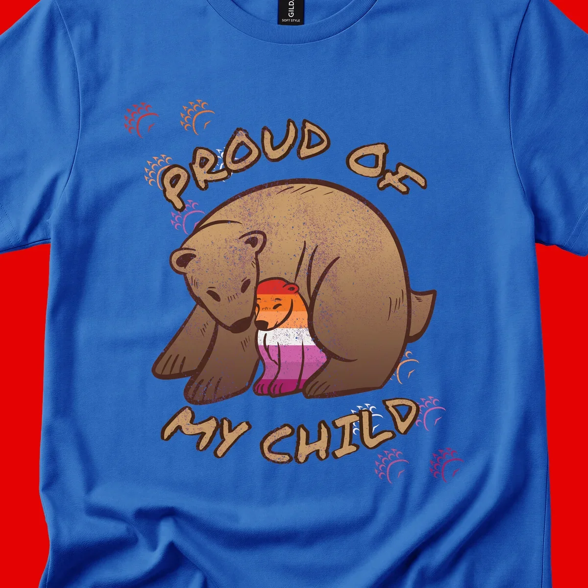Brown bear proudly holding a sushi roll with pride flag stripes, surrounded by sparkles and text reading 'PROUD AS MY SUSHI'