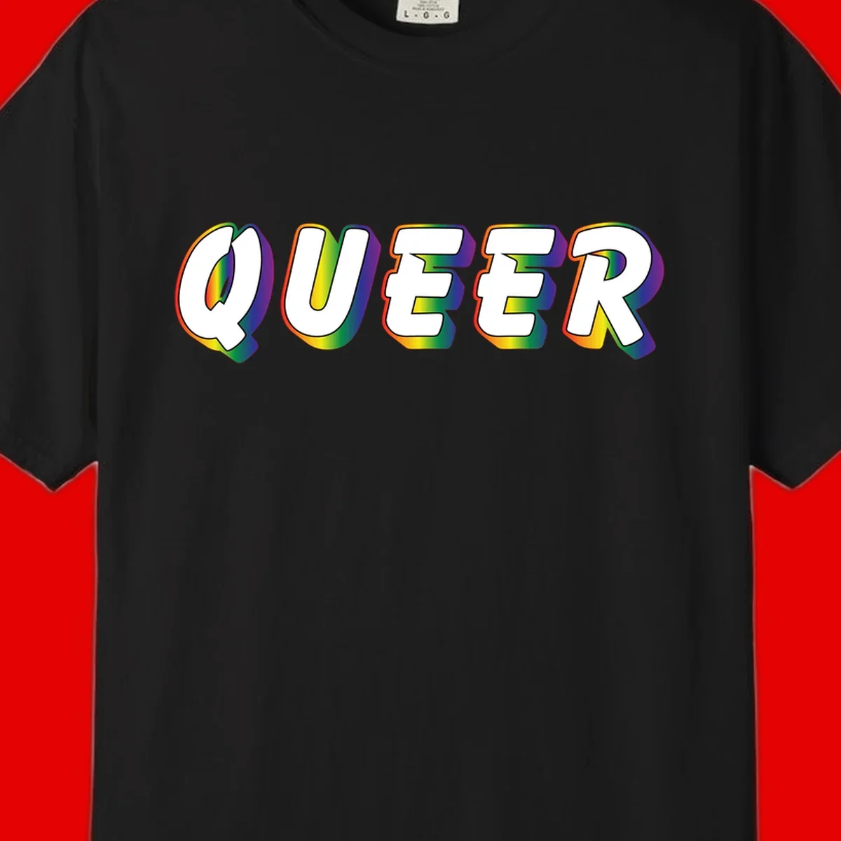 The word QUEER in large bold white letters with vibrant rainbow gradient fill and 3D orange outline effect on gray background
