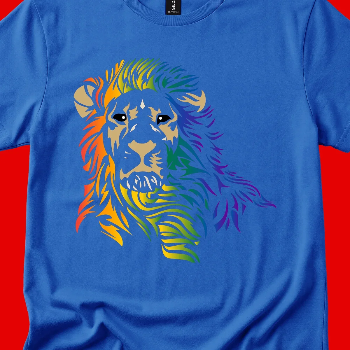 Rainbow lion head with gradient mane flowing from red through purple, featuring tan face with black eyes and detailed whiskers on gray background