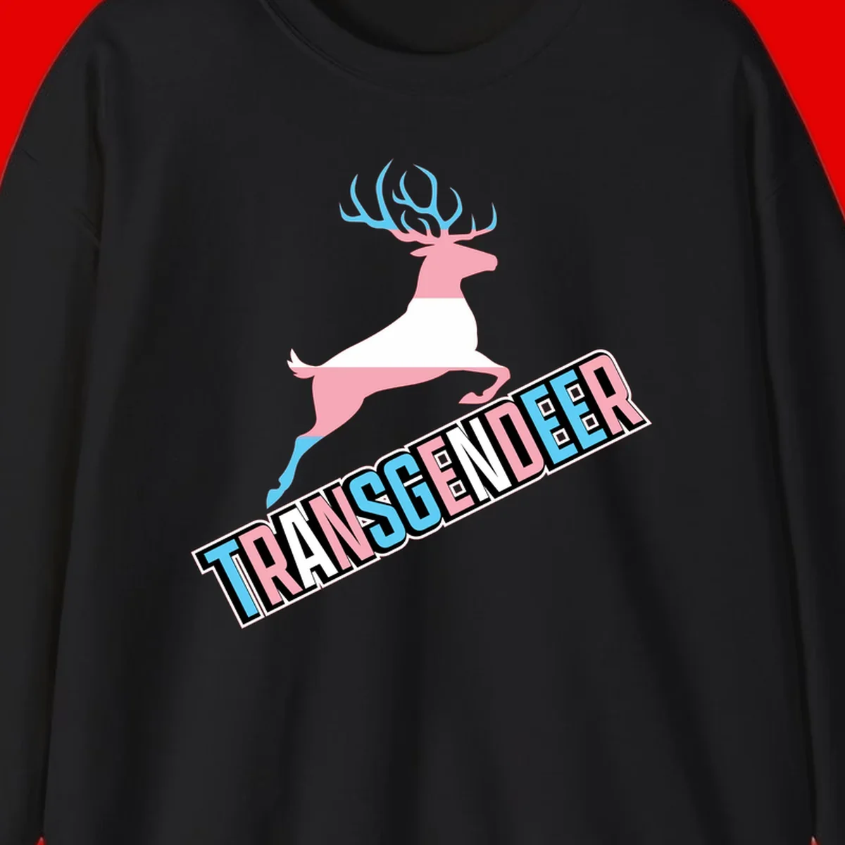Transgender deer pride design: pink and white deer leaping with blue and pink antlers, 'TRANSGENDER' text banner below in pride colors