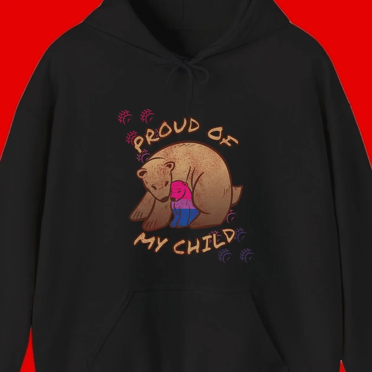 Brown bear holding rainbow pride flag with text reading 'Proud As My Chub' on gray background