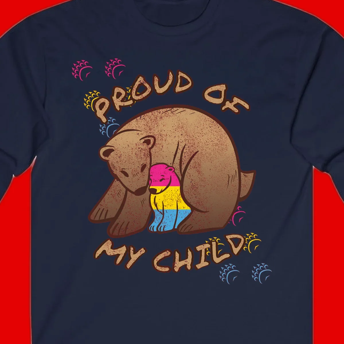 Large bear proudly hugging a smaller bear cub wearing a pride flag shirt, with text reading 'Proud As My Child'