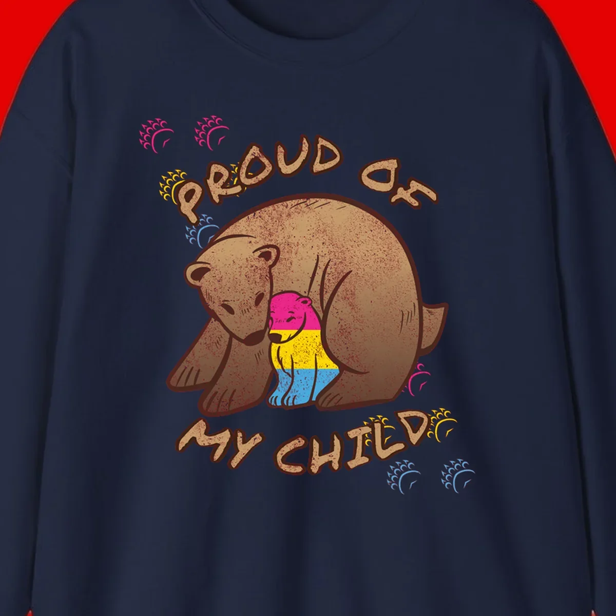Large bear proudly hugging a smaller bear cub wearing a pride flag shirt, with text reading 'Proud As My Child'