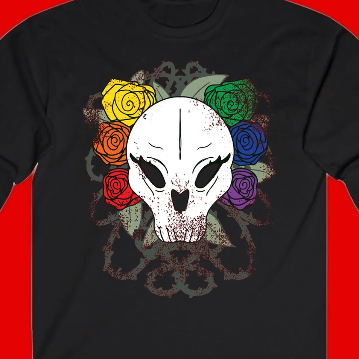 White skull with rainbow colored roses in yellow, orange, red, blue, green, and purple surrounding it on gray background