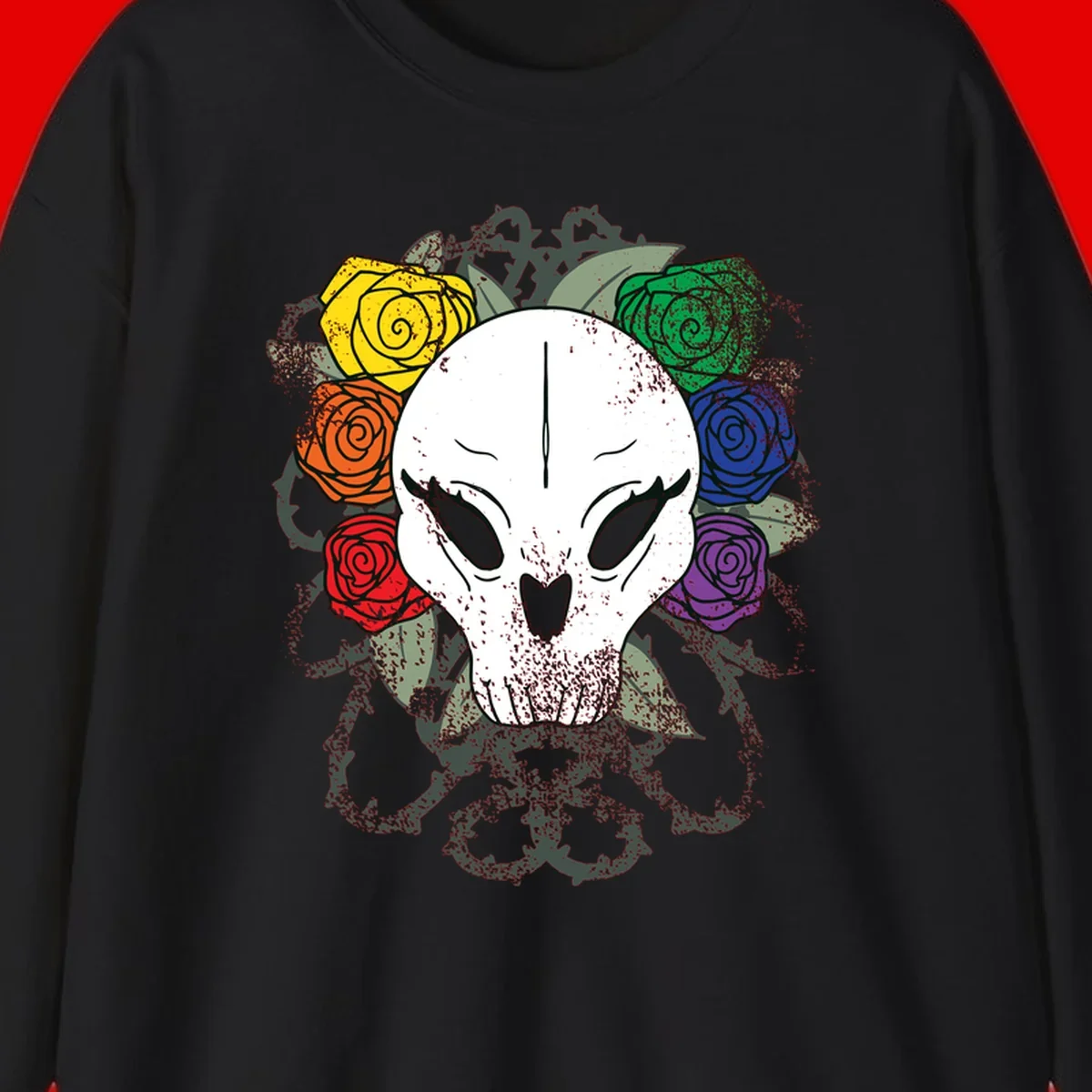 White skull with rainbow colored roses in yellow, orange, red, blue, green, and purple surrounding it on gray background