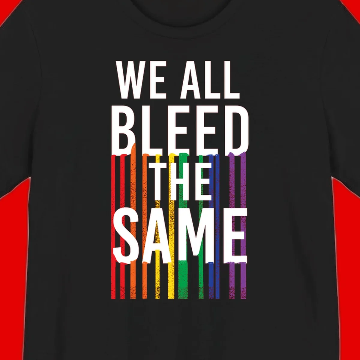 White bold text 'We All Bleed The Same' over rainbow vertical stripes in pride flag colors on gray background