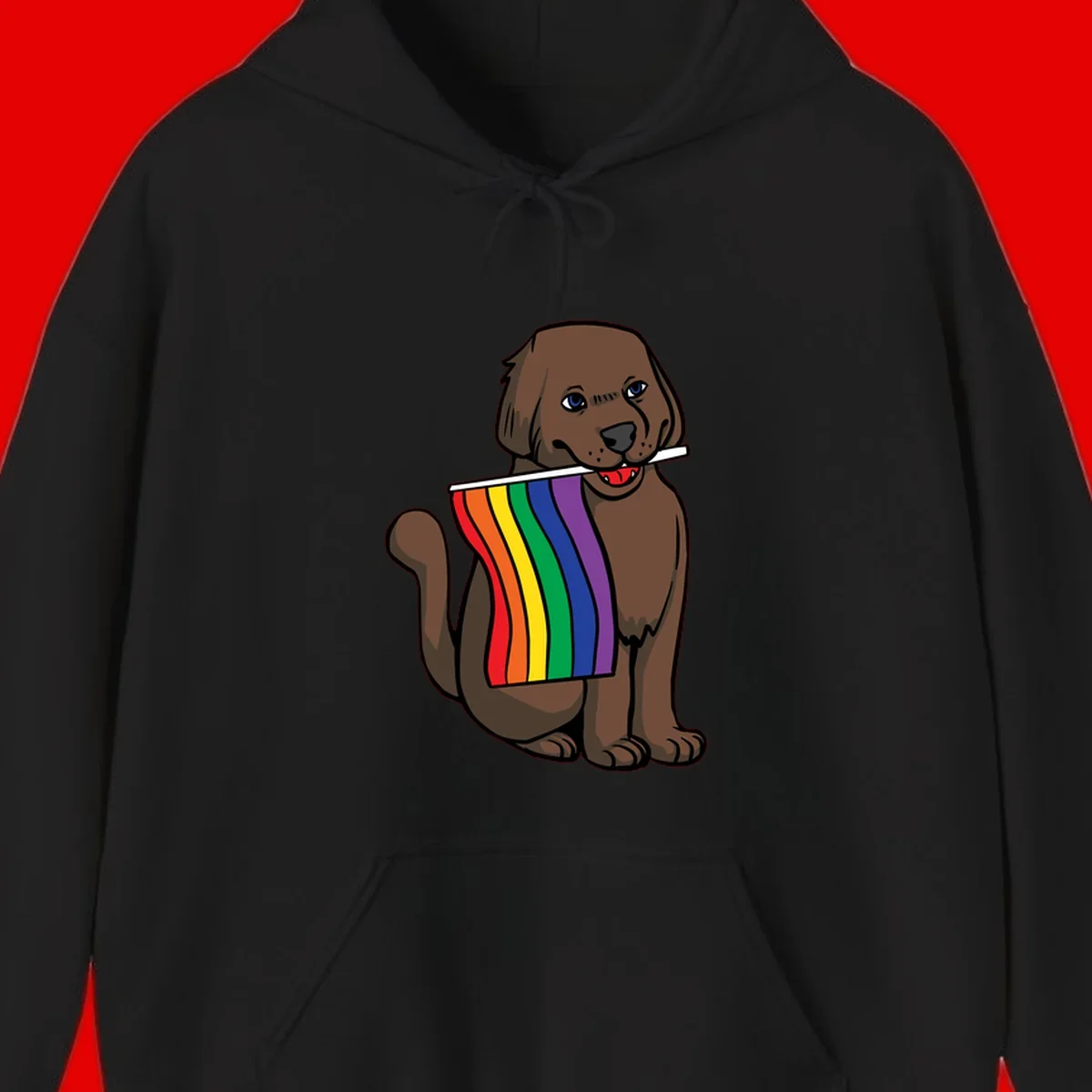 Brown dog holding rainbow pride flag with happy expression and blue eyes