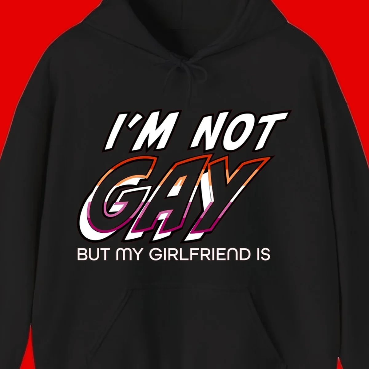 Bold typography design reading 'I'm not gay but my girlfriend is' in orange and magenta layered 3D letters