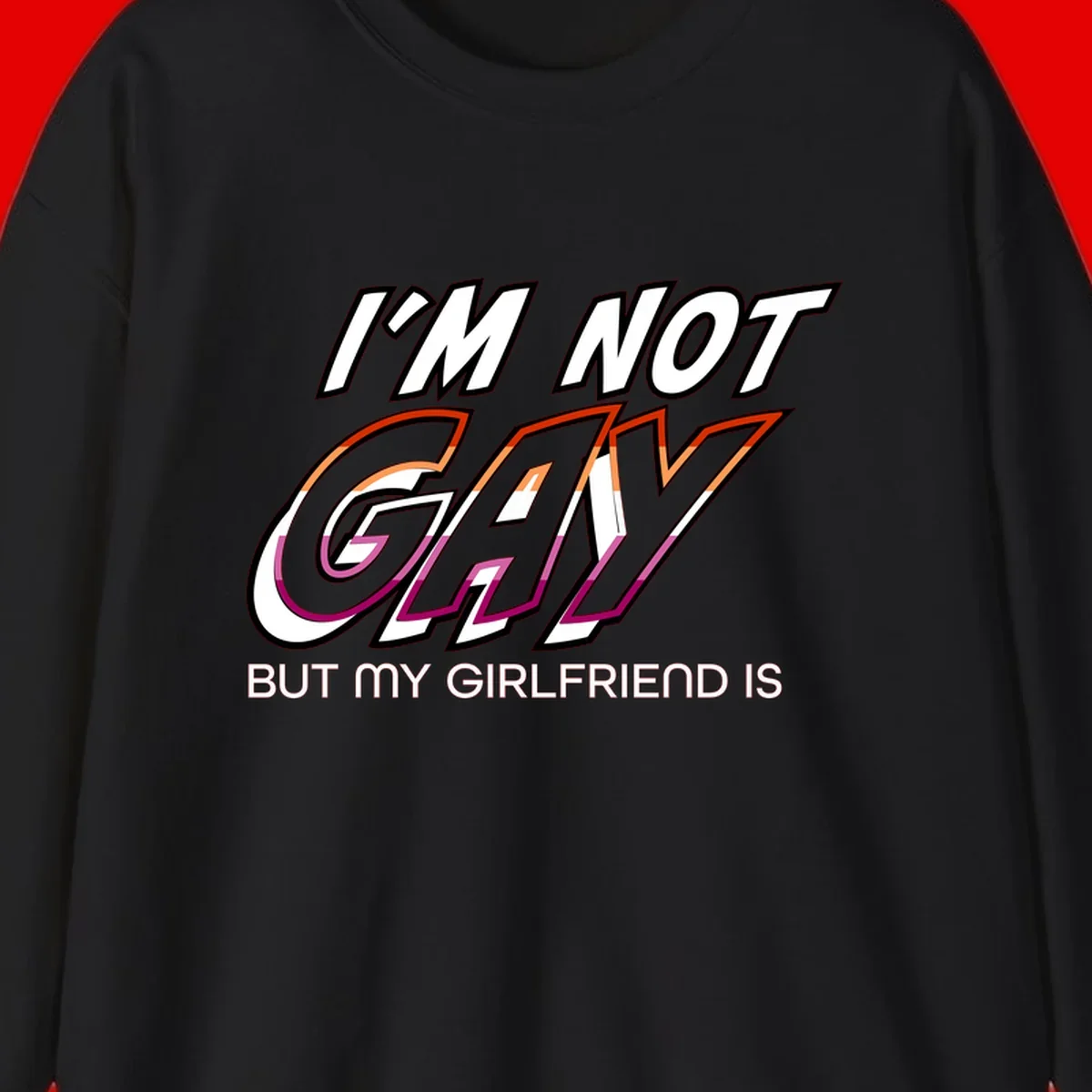 Bold typography design reading 'I'm not gay but my girlfriend is' in orange and magenta layered 3D letters