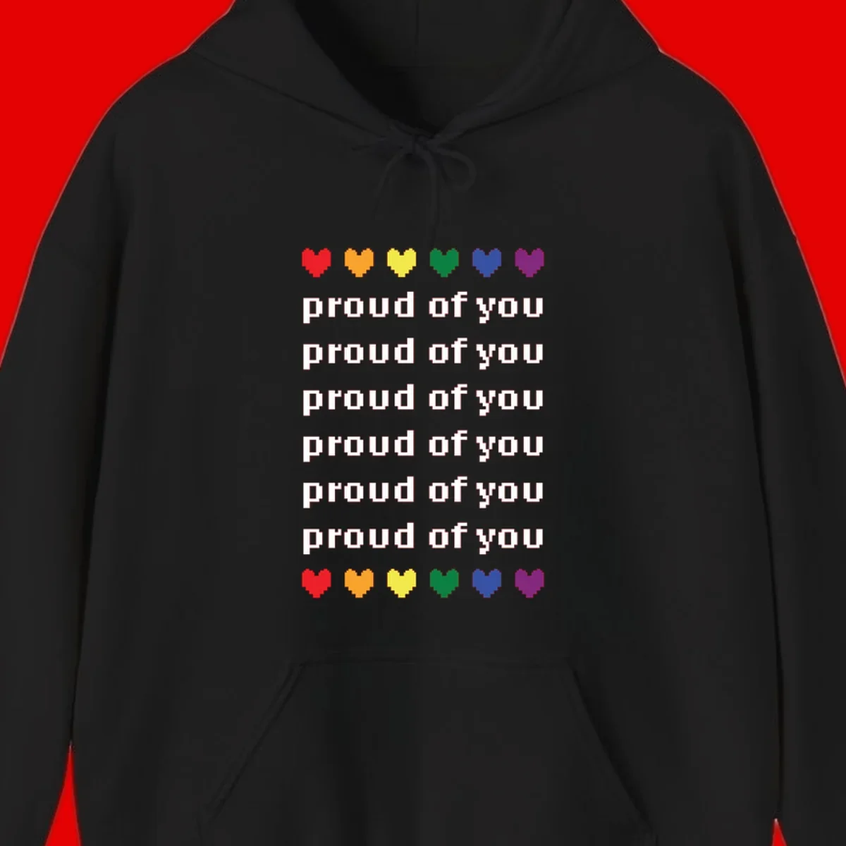 Pixelated rainbow hearts in pride flag colors with repeated 'proud of you' text on gray background