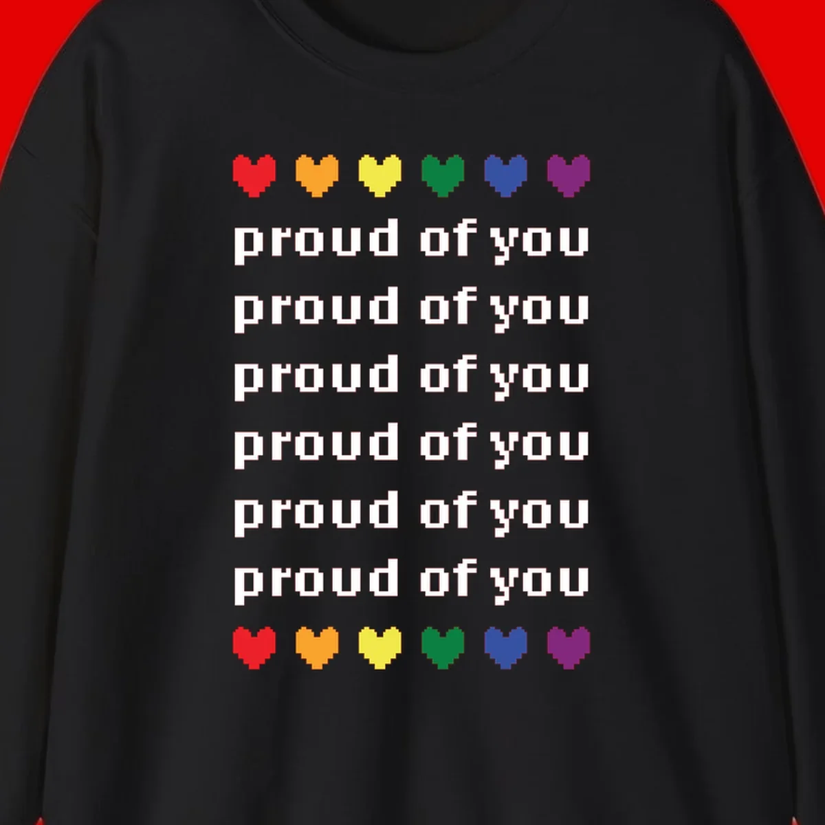 Pixelated rainbow hearts in pride flag colors with repeated 'proud of you' text on gray background