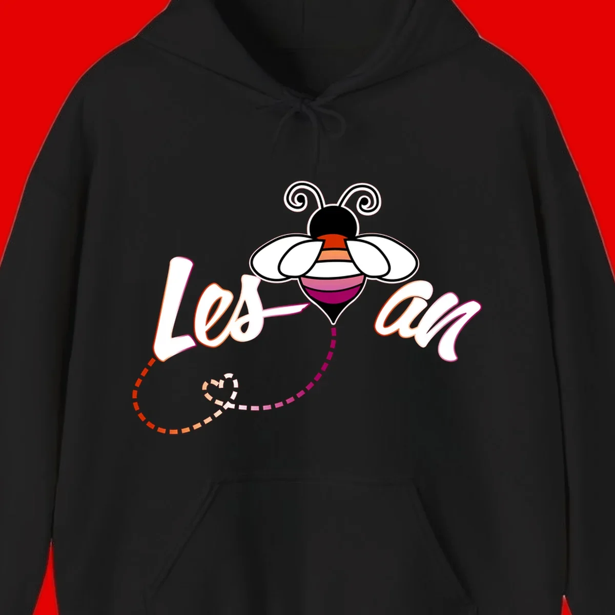 Colorful bee with spiral antennae and rainbow striped body above the word Love in flowing lettering with dashed trail