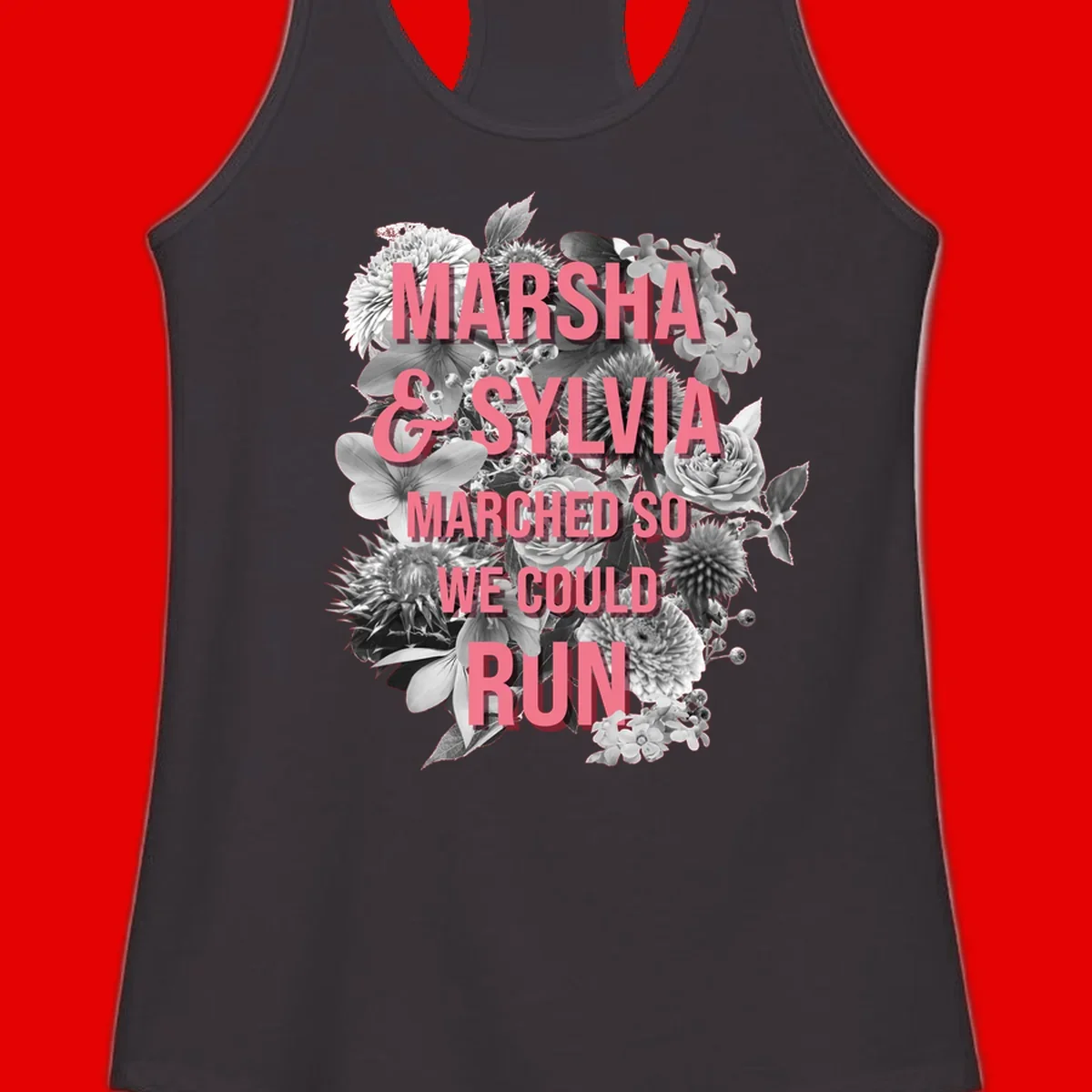 Pink text reading 'Marsha & Sylvia Marched So We Could Run' overlaid on black and white floral arrangement with roses and dahlias
