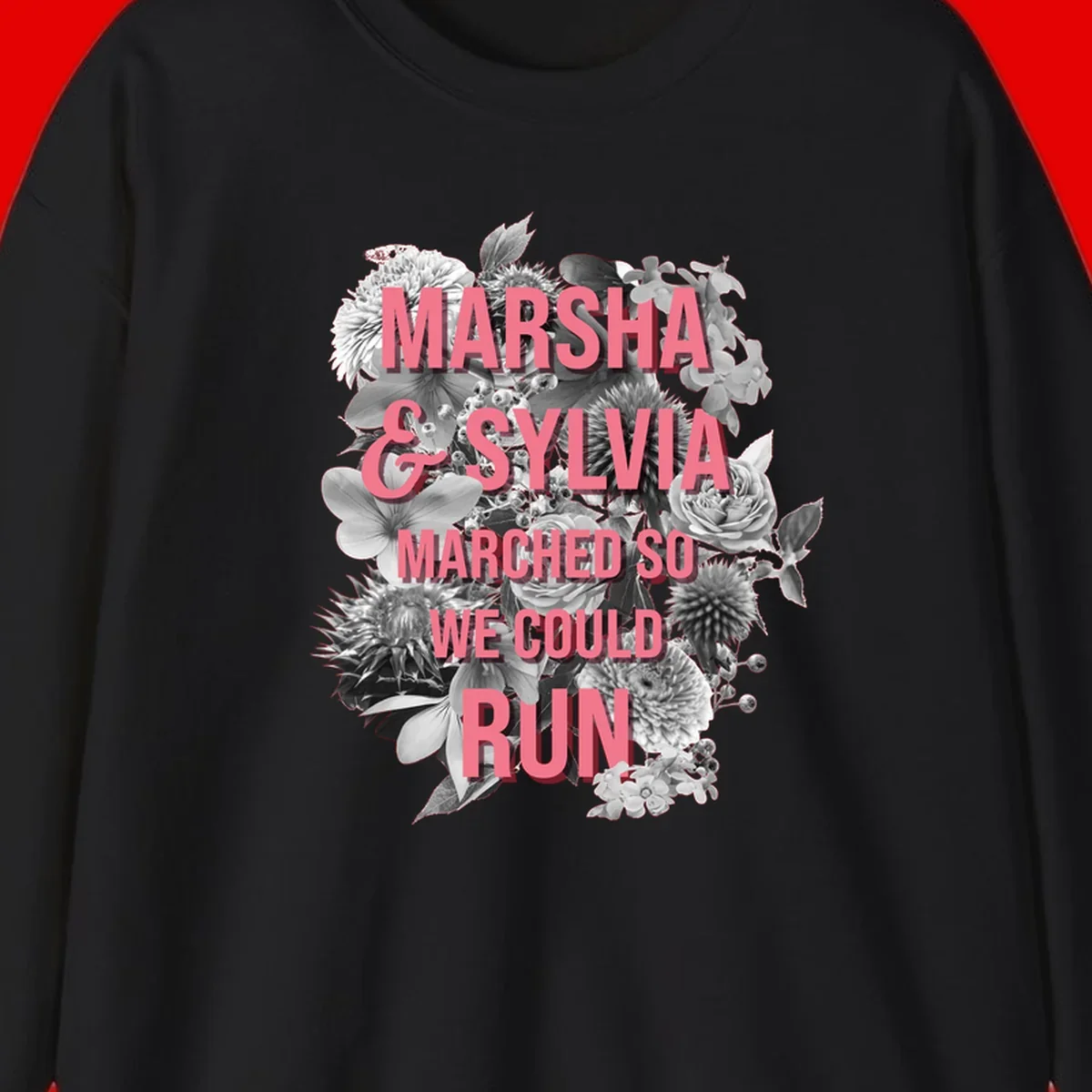 Pink text reading 'Marsha & Sylvia Marched So We Could Run' overlaid on black and white floral arrangement with roses and dahlias