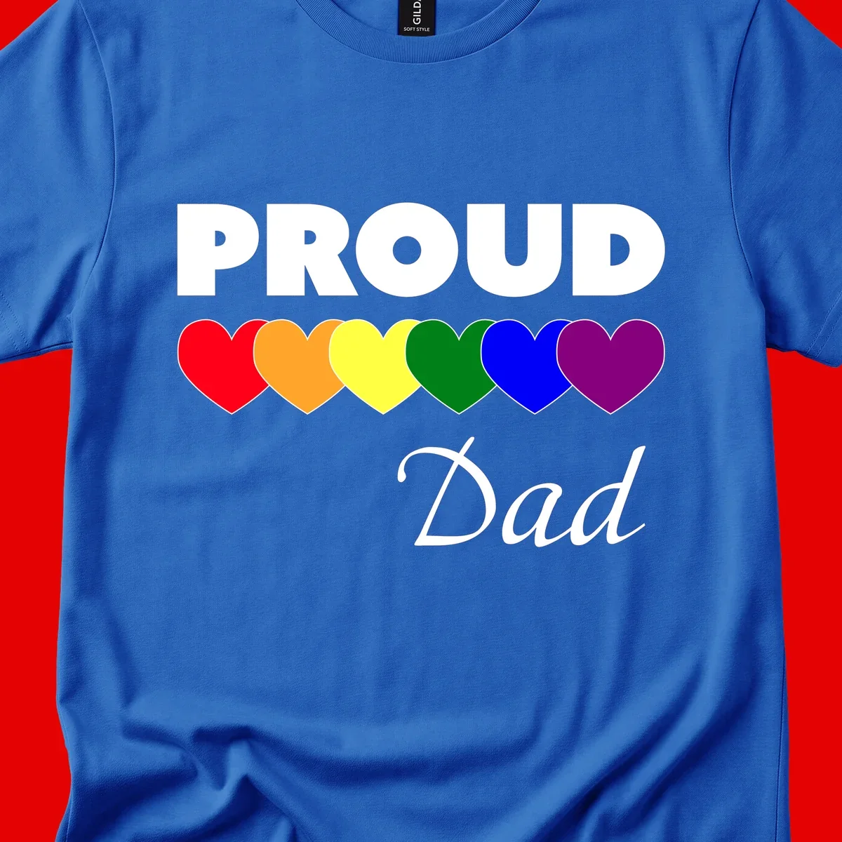 Proud Dad Pride design featuring bold white text with six rainbow-colored hearts in red, orange, yellow, green, blue, and purple