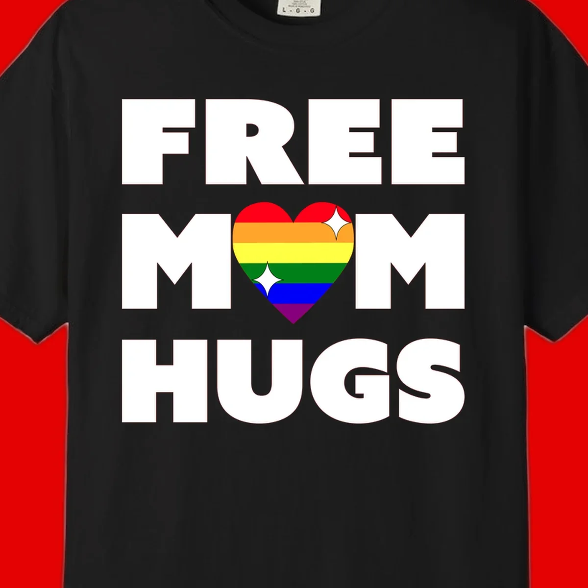 Free Mom Hugs design with rainbow pride heart featuring red, orange, yellow, green, blue, and purple stripes with white sparkles