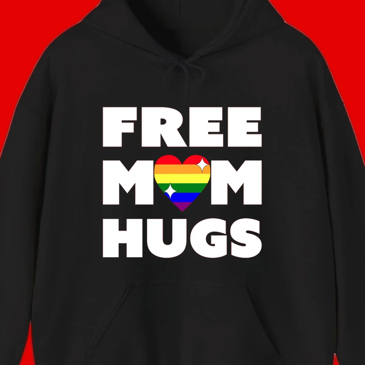 Free Mom Hugs design with rainbow pride heart featuring red, orange, yellow, green, blue, and purple stripes with white sparkles