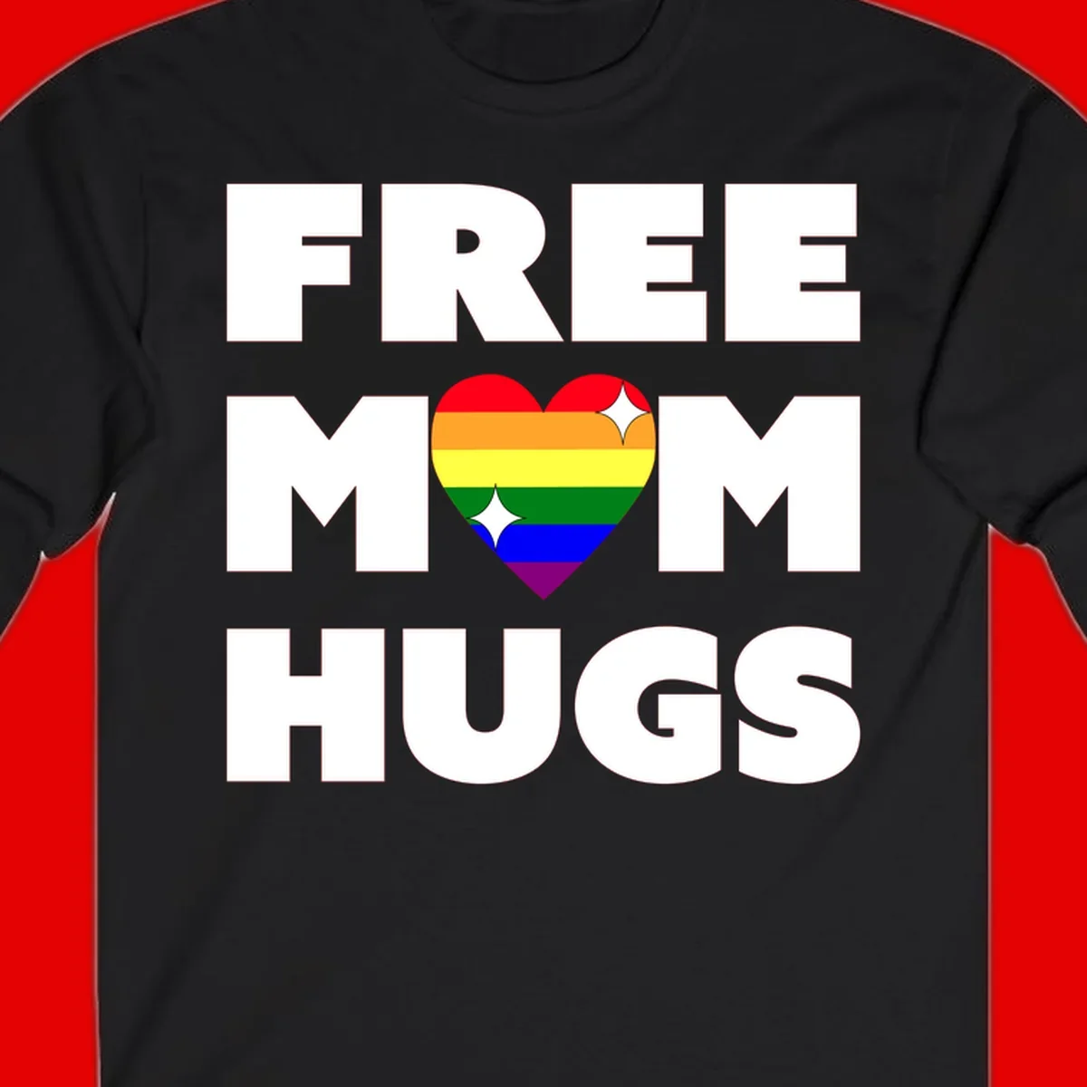Free Mom Hugs design with rainbow pride heart featuring red, orange, yellow, green, blue, and purple stripes with white sparkles