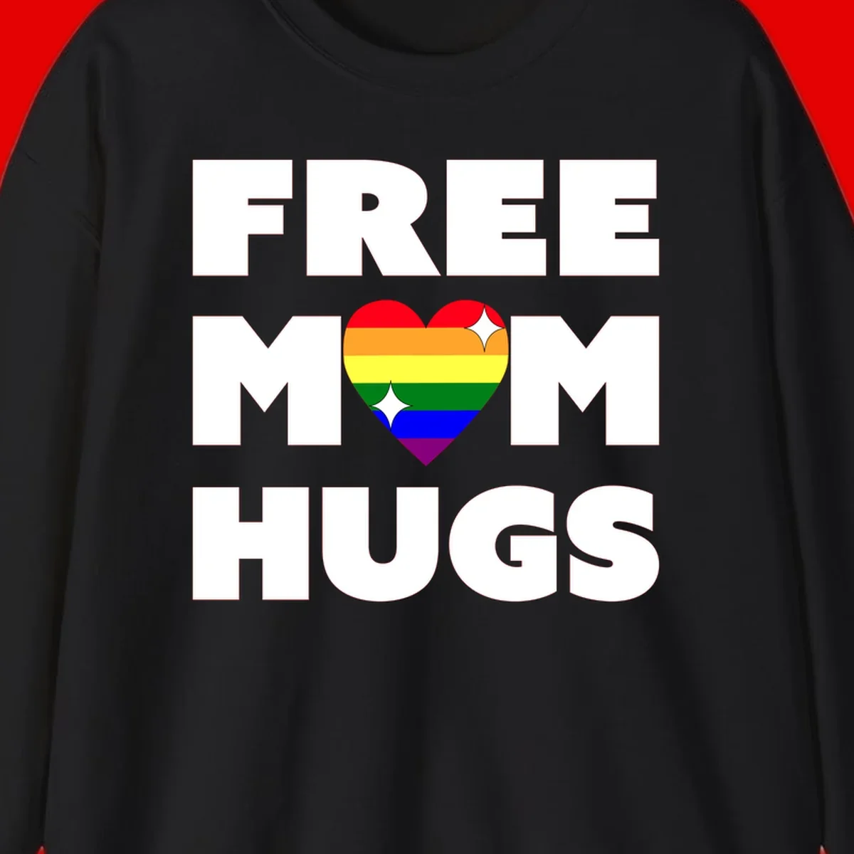 Free Mom Hugs design with rainbow pride heart featuring red, orange, yellow, green, blue, and purple stripes with white sparkles