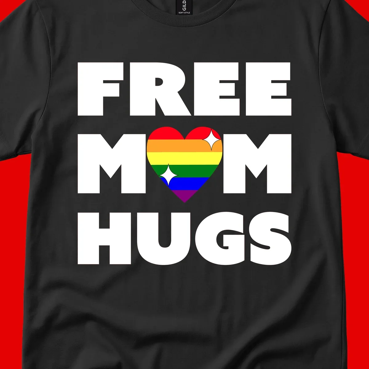 Free Mom Hugs design with rainbow pride heart featuring red, orange, yellow, green, blue, and purple stripes with white sparkles