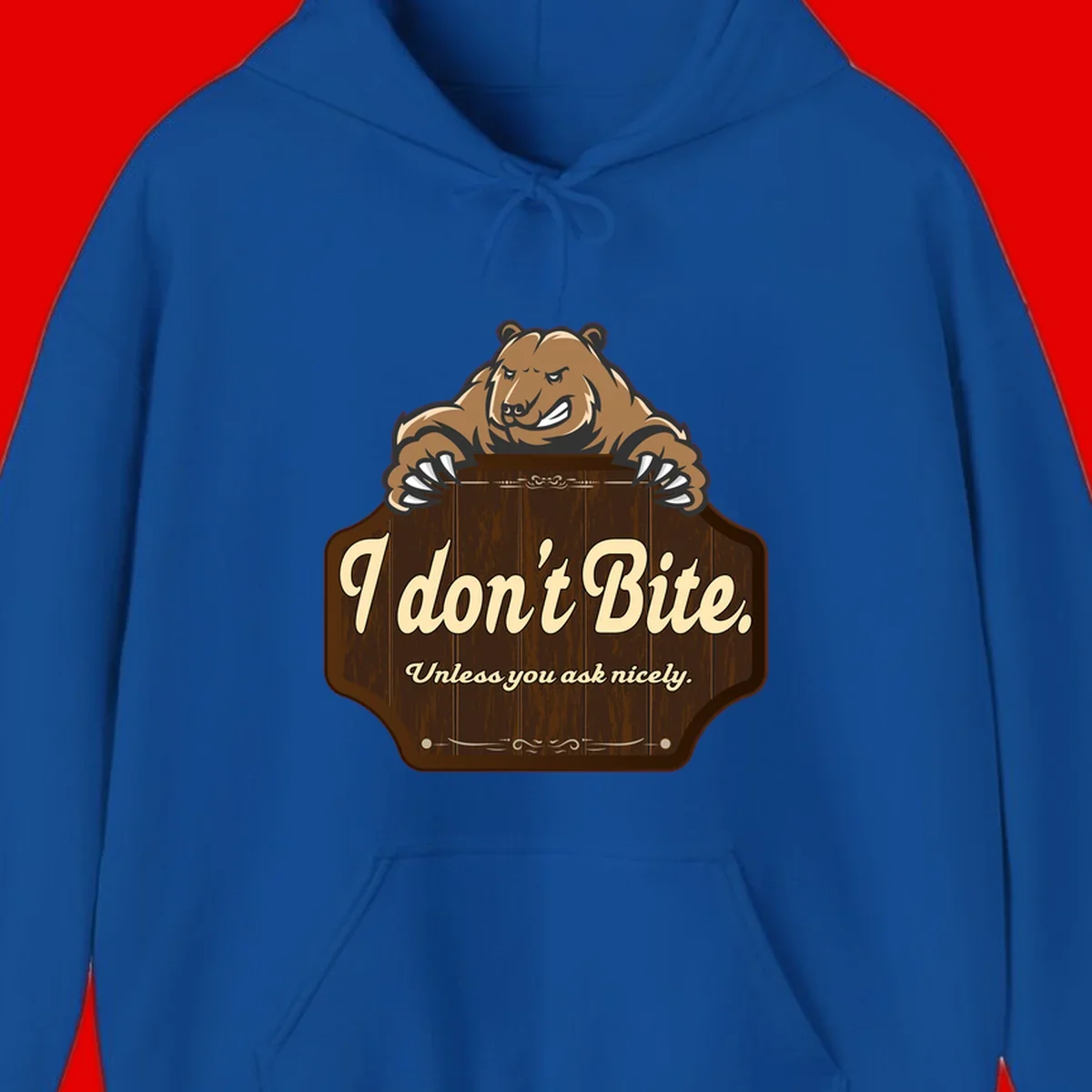 Brown grizzly bear grinning mischievously while holding a wooden sign reading 'I don't Bite. Unless you ask nicely' with decorative vintage styling