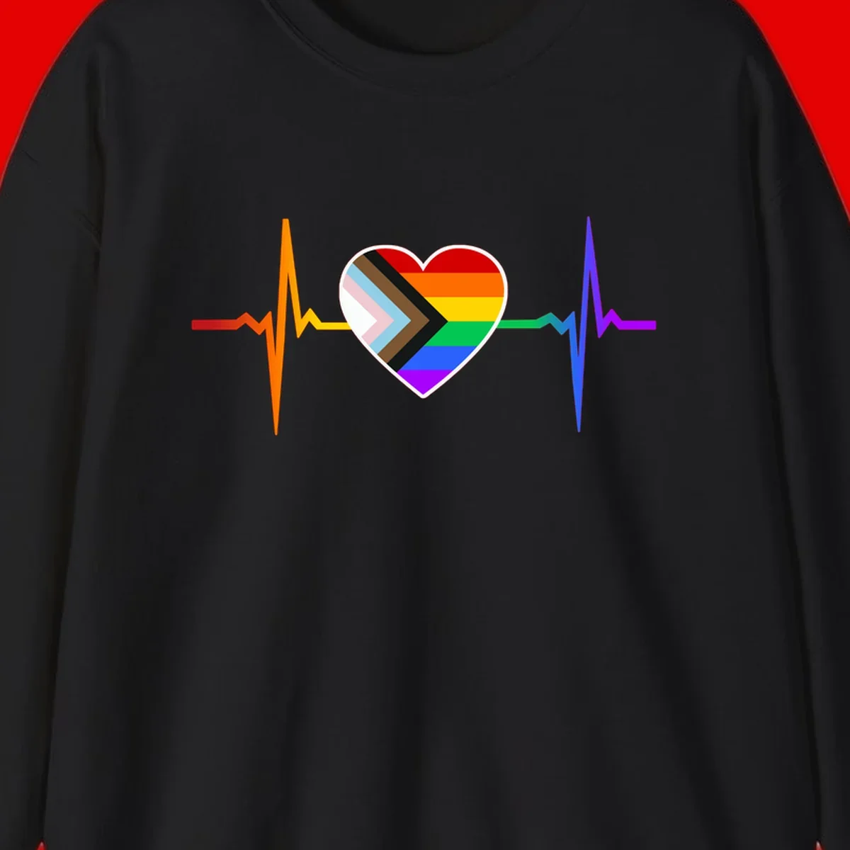 Progress pride heartbeat design featuring a rainbow heart with progress chevron arrow and electrocardiogram pulse line