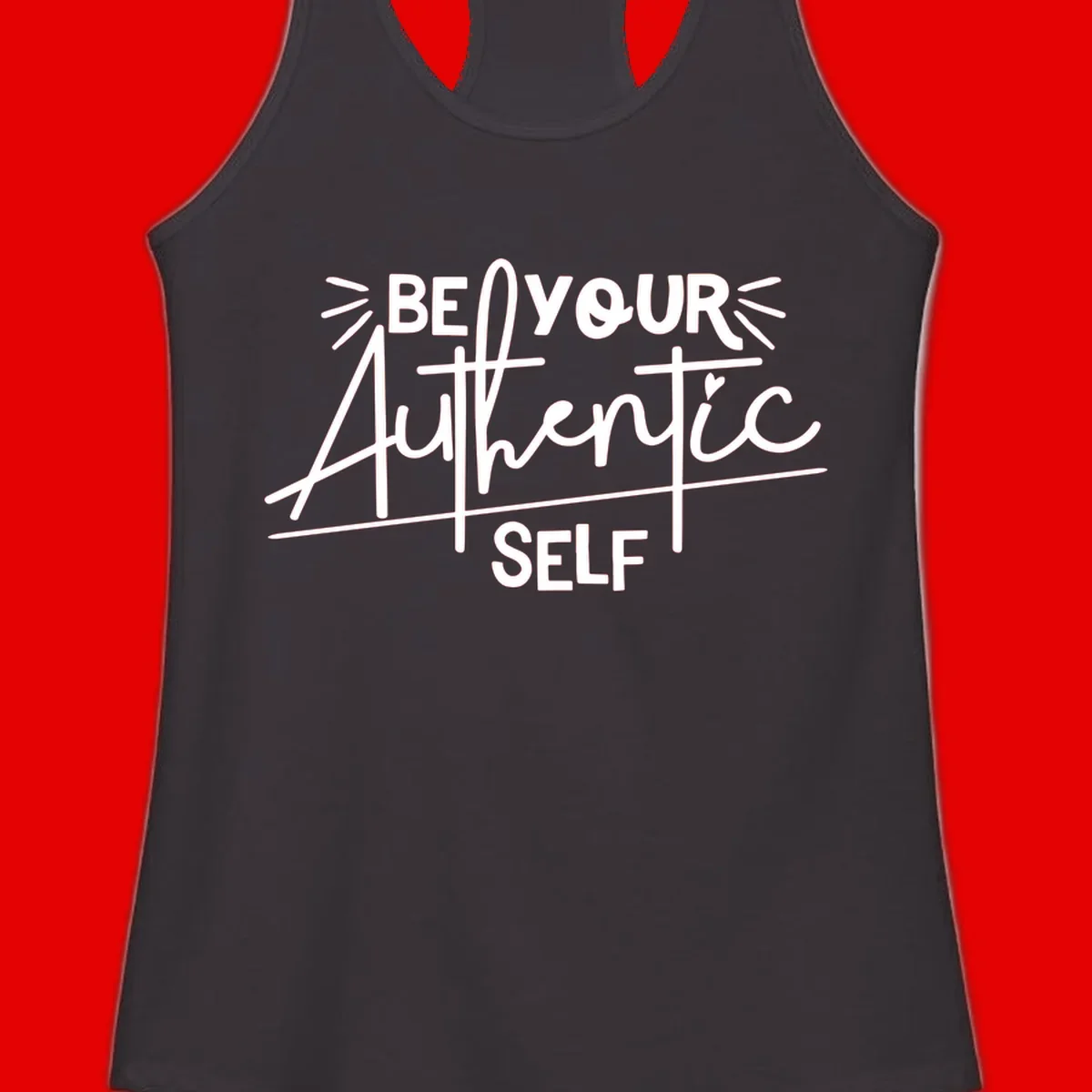 White hand-lettered text reading 'Be Your Authentic Self' with decorative radiating lines and a small heart on gray background