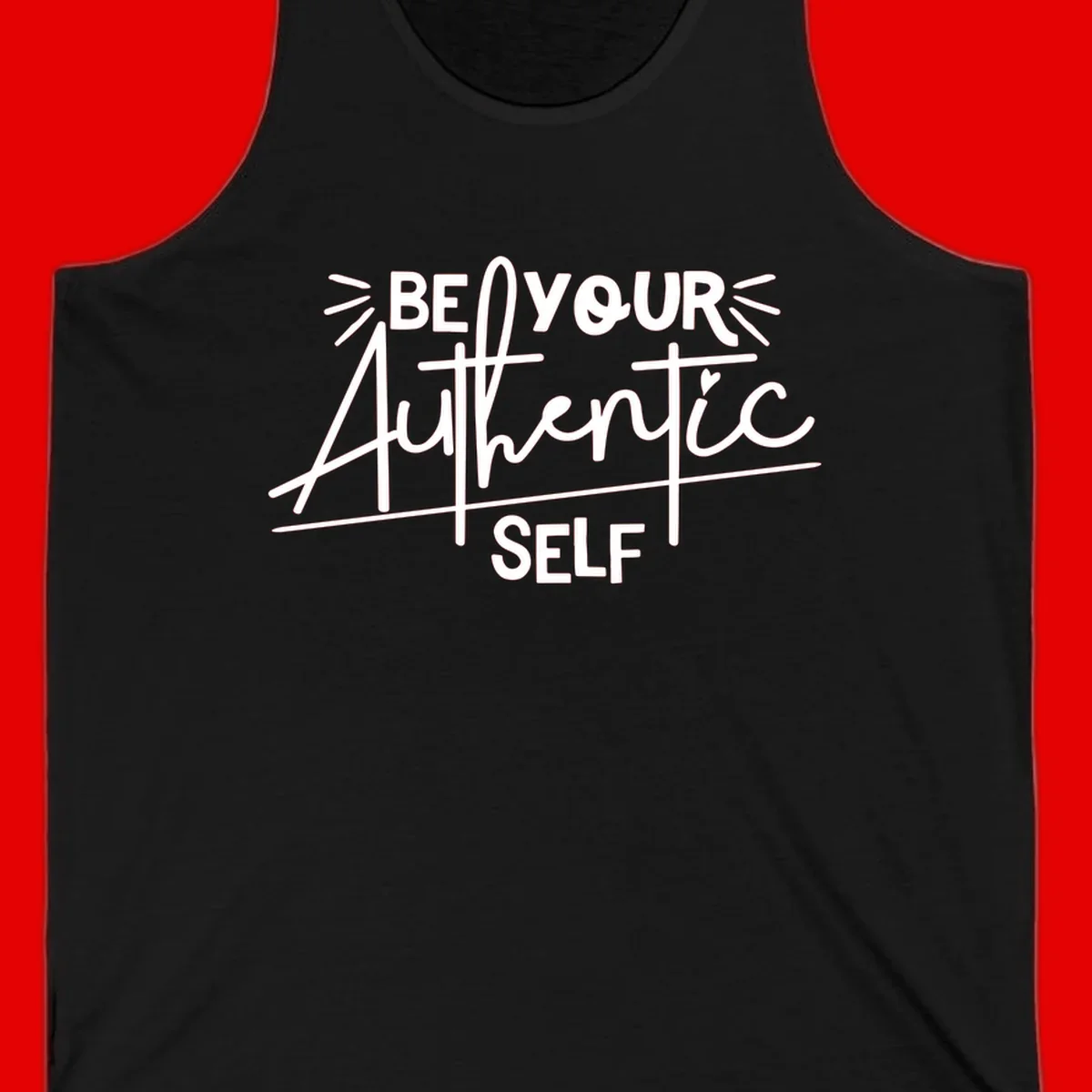 White hand-lettered text reading 'Be Your Authentic Self' with decorative radiating lines and a small heart on gray background